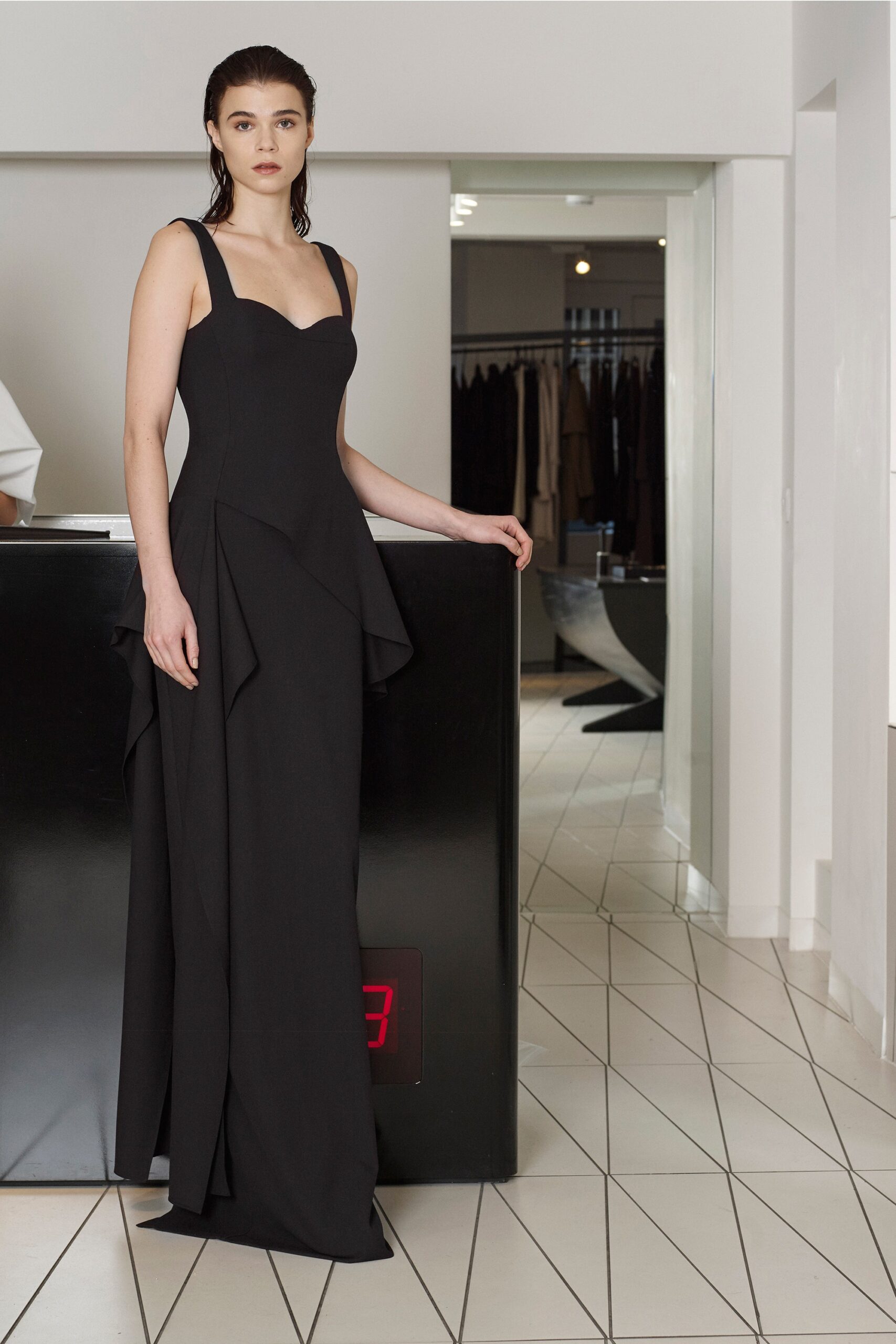 black sweetheart draped evening gown