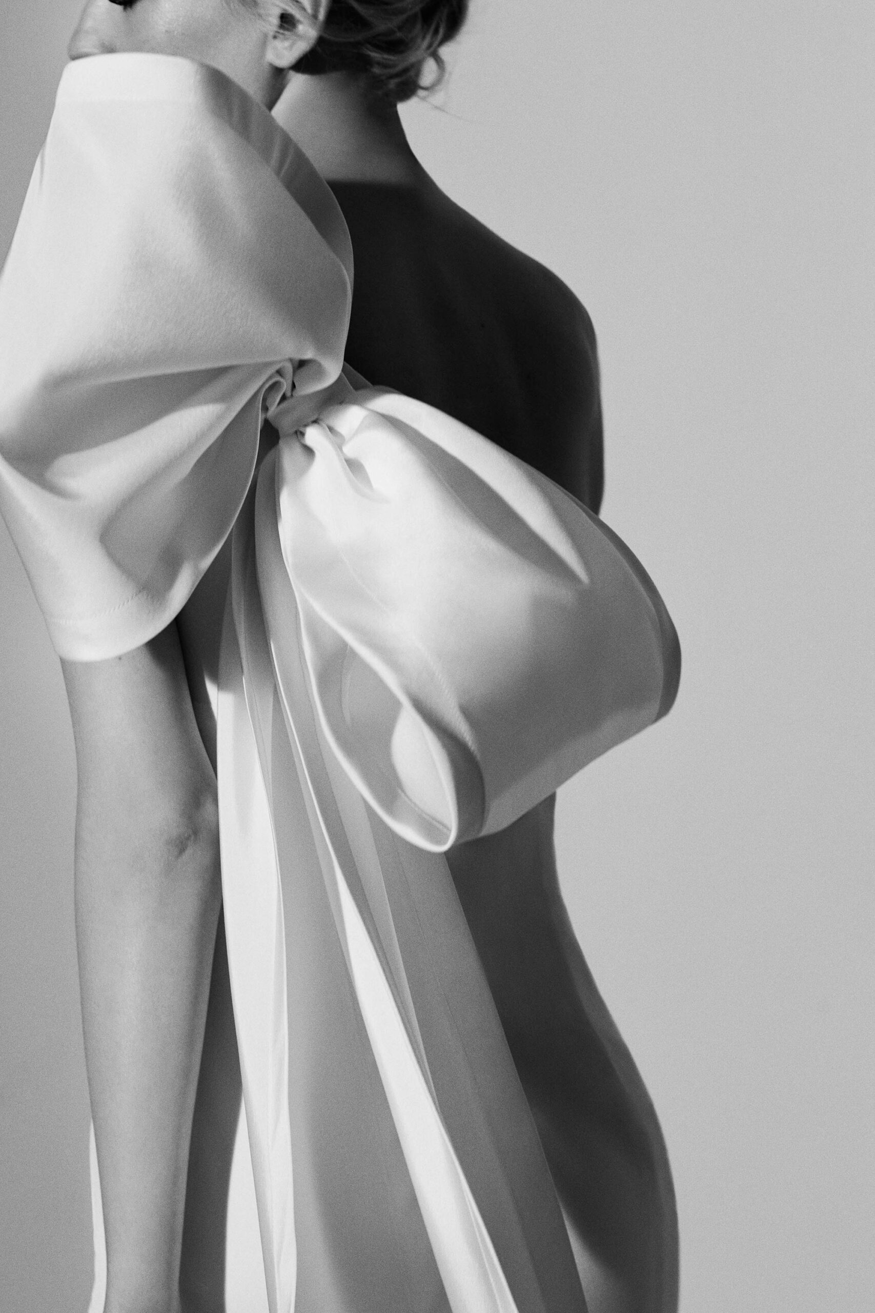 white satin bow evening gown