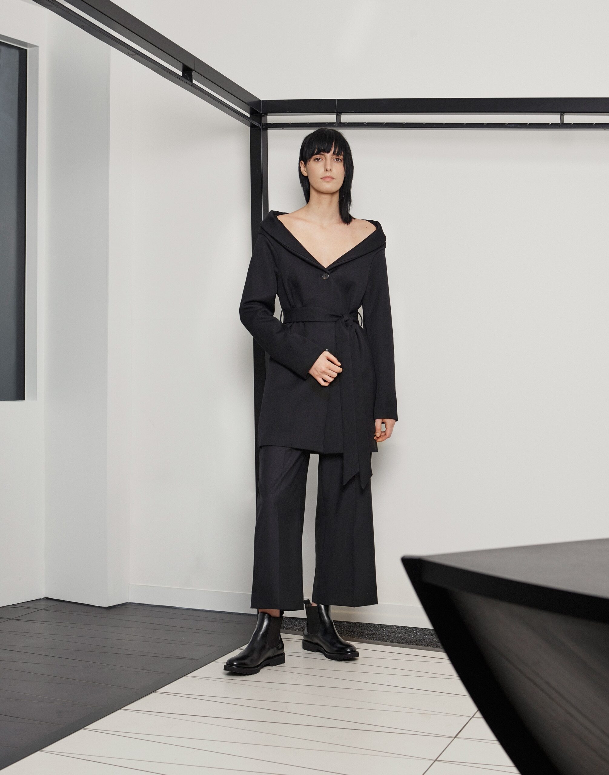 black off-shoulder belted wrap coat