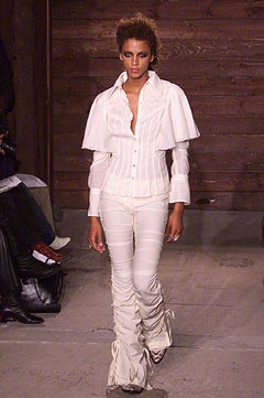 white capelet shirt with ruched trousers