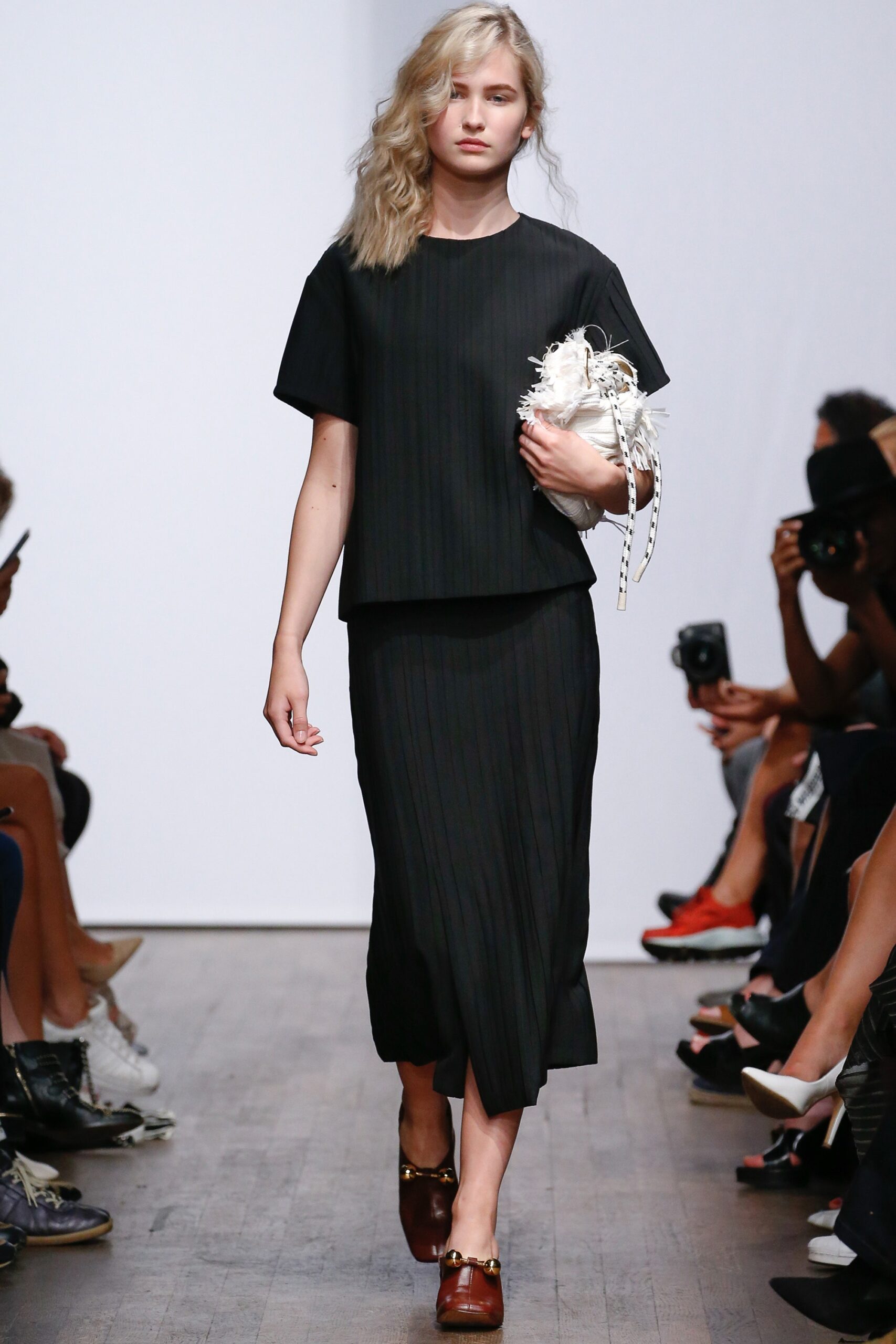 black pleated asymmetric midi skirt