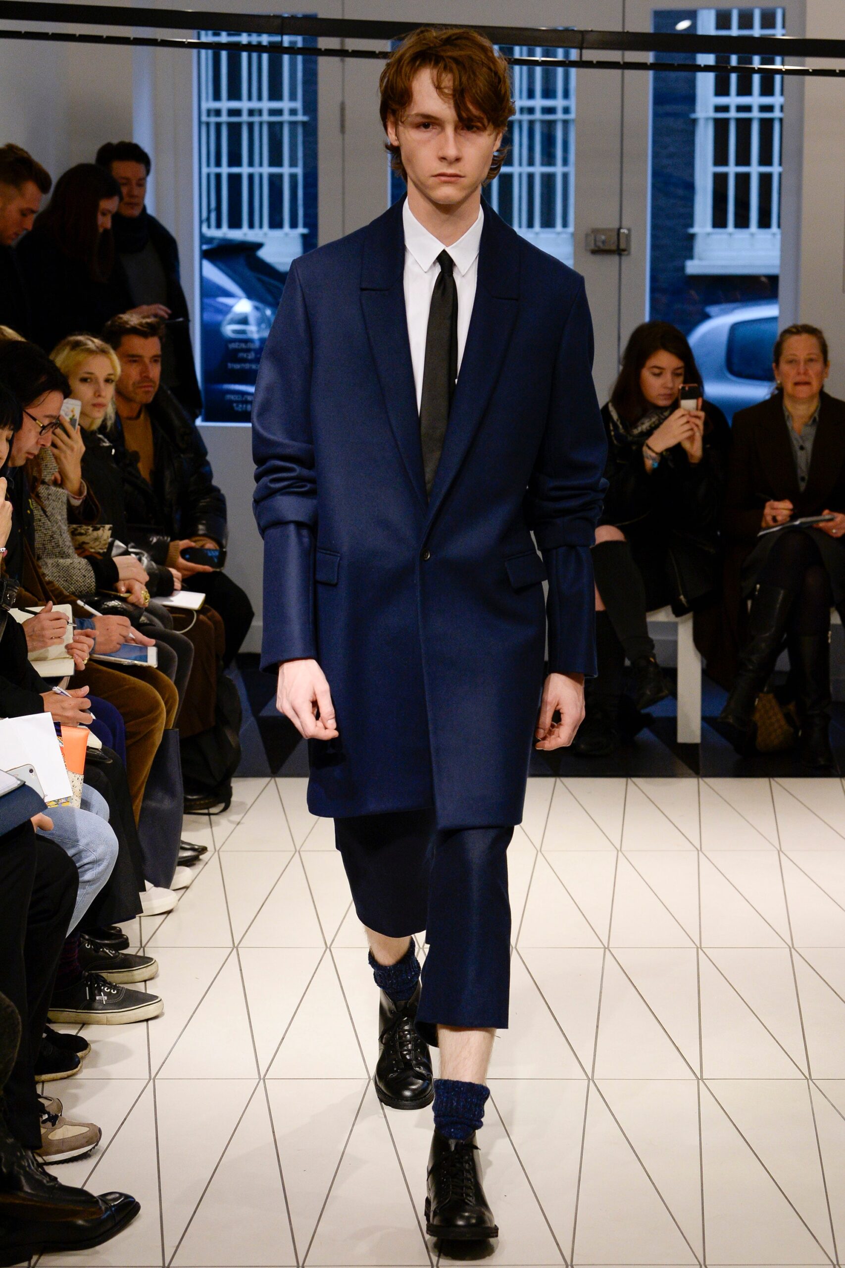 blue tailored overcoat with cropped trousers