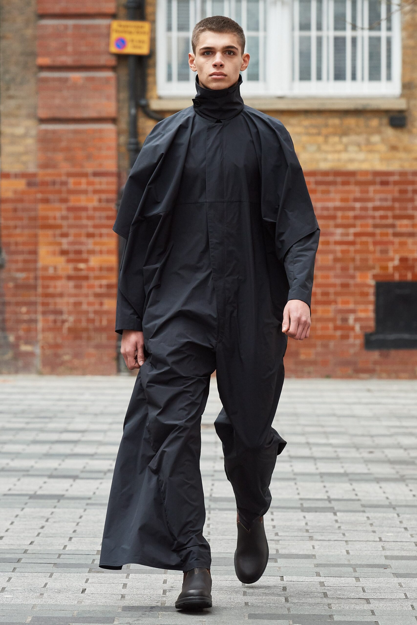 black poncho-overlay jumpsuit