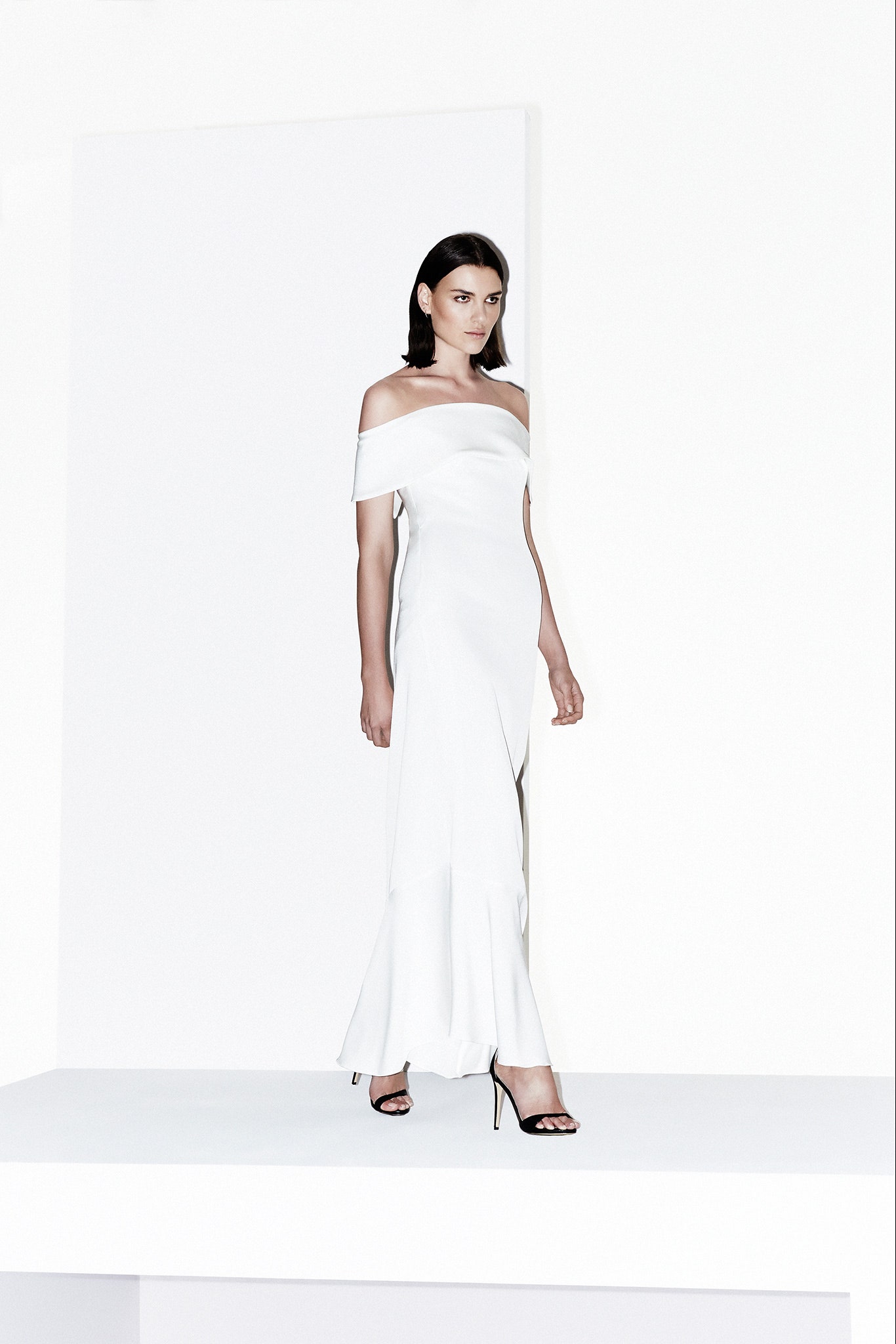 white crepe off-shoulder fitted flared flowing maxi gown