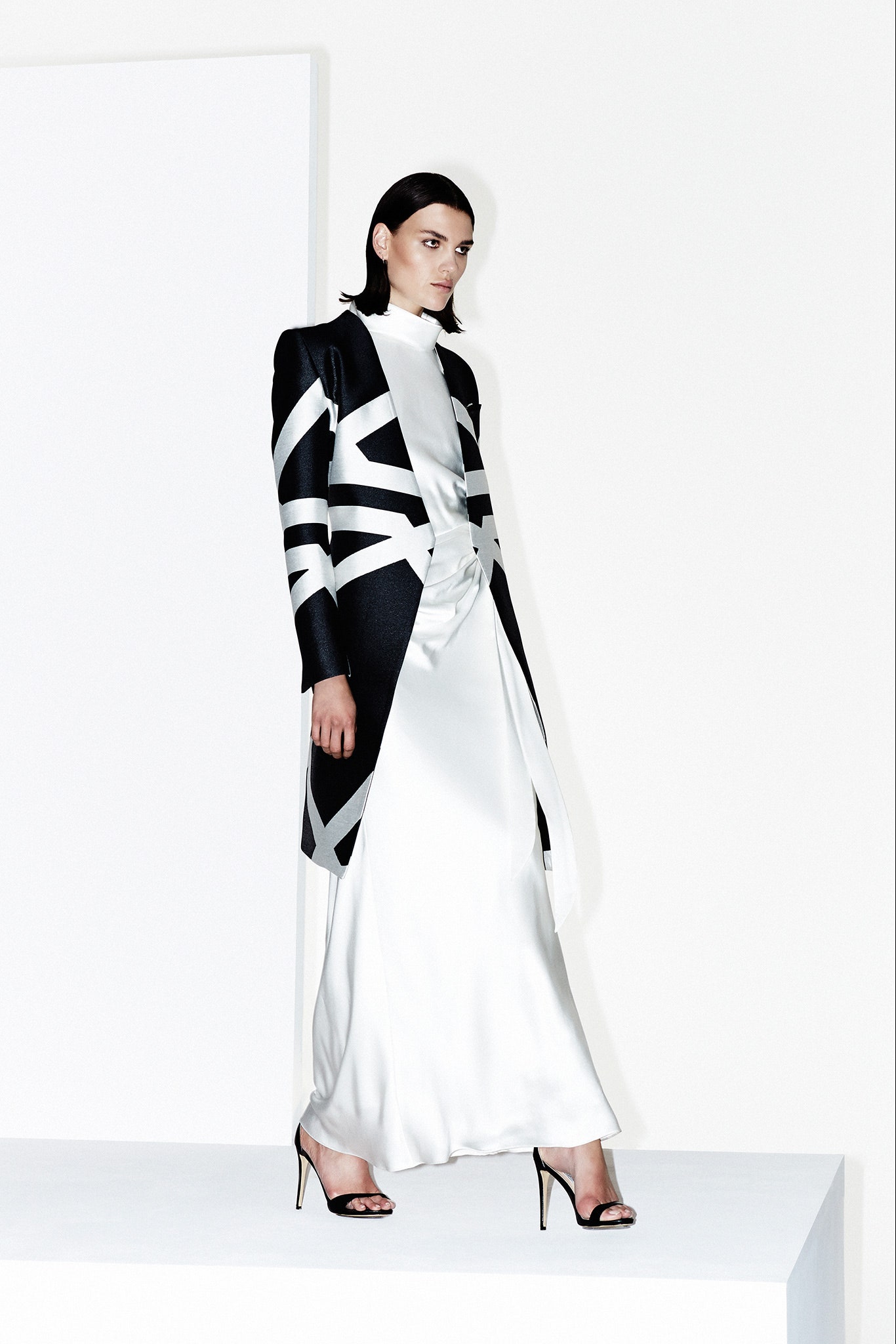 white satin high-neck sleeveless relaxed draped gown