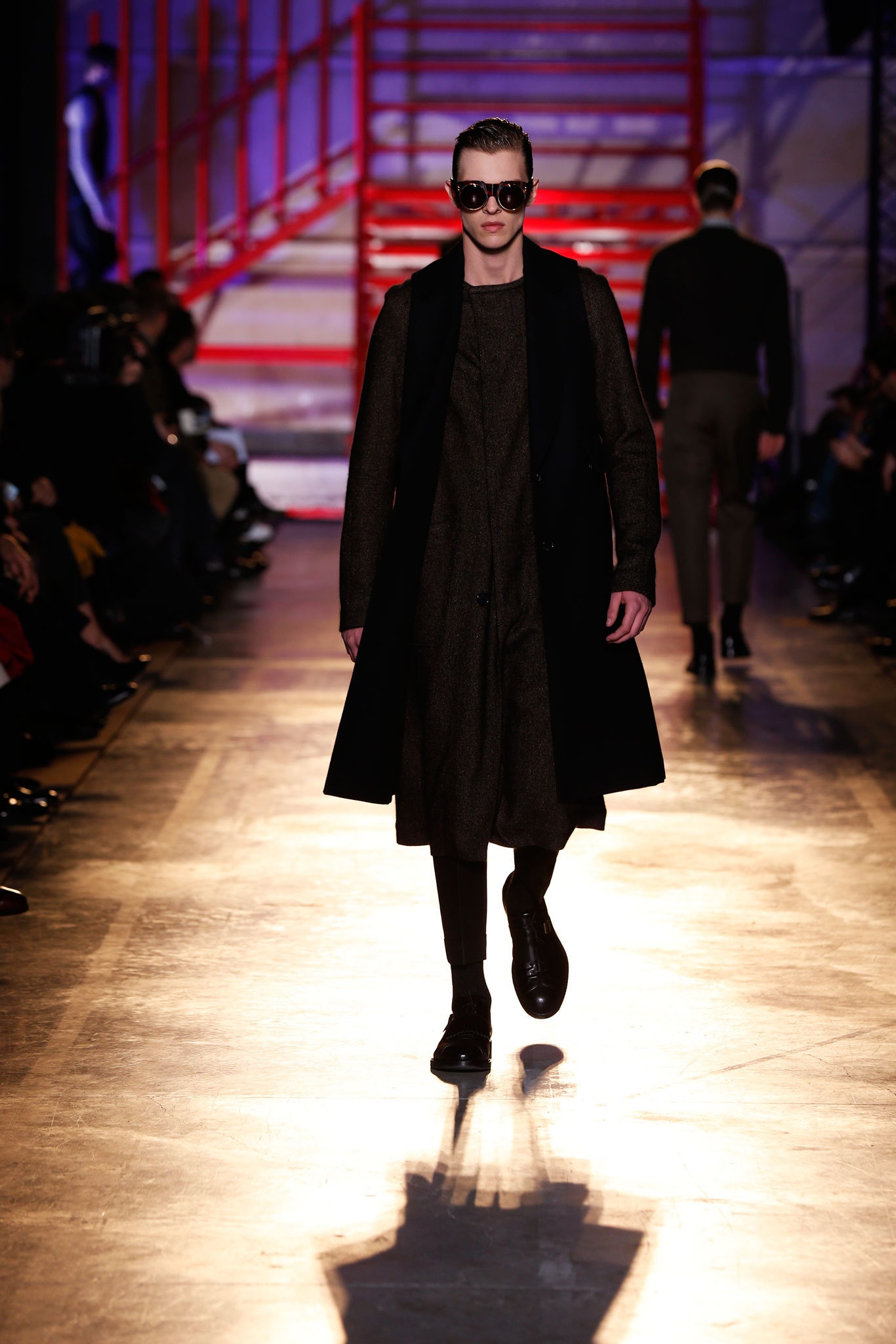 sleeveless black overcoat