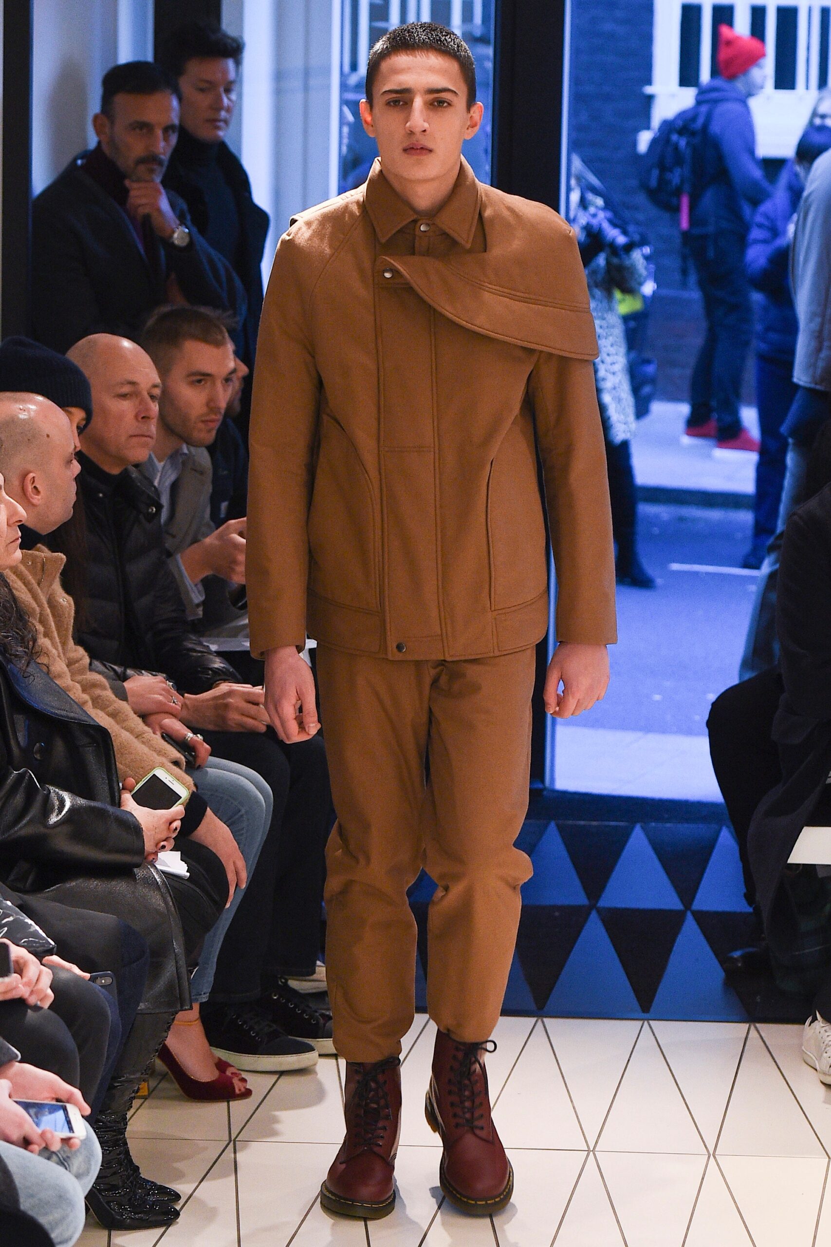 asymmetric brown jacket with shoulder capelet