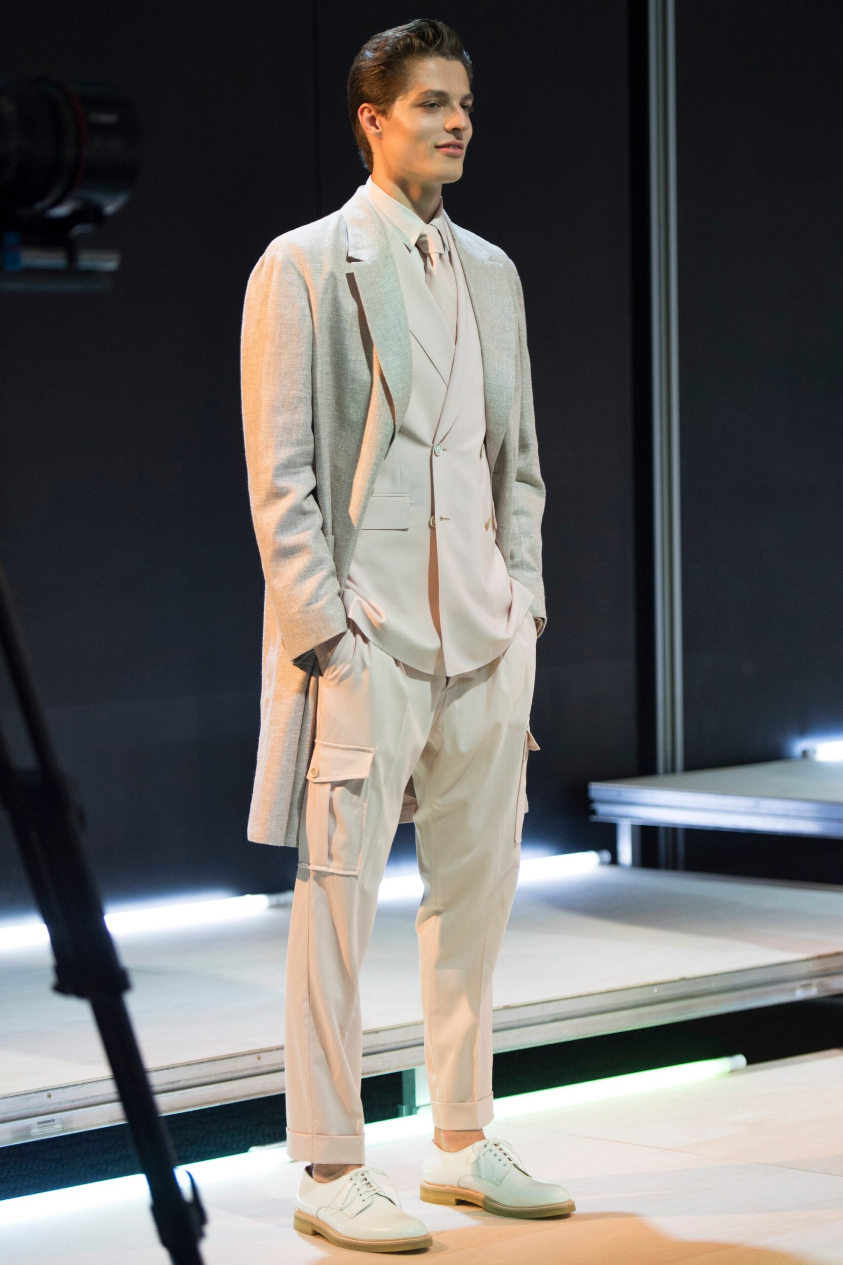 long gray overcoat with ivory tailoring