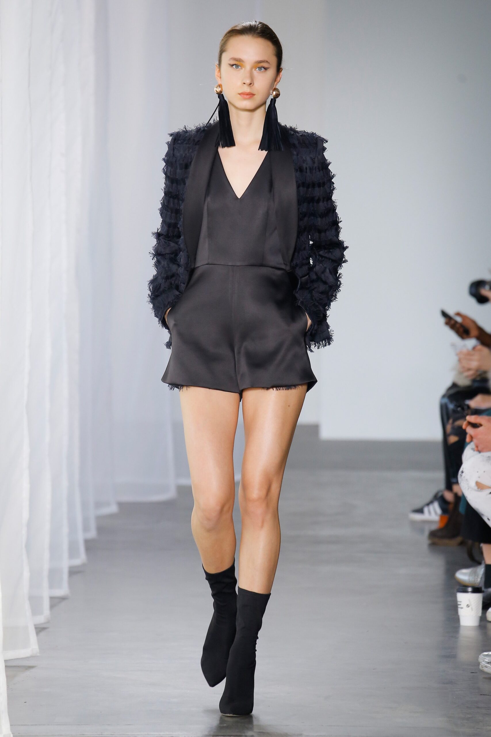black satin romper with fringed bolero
