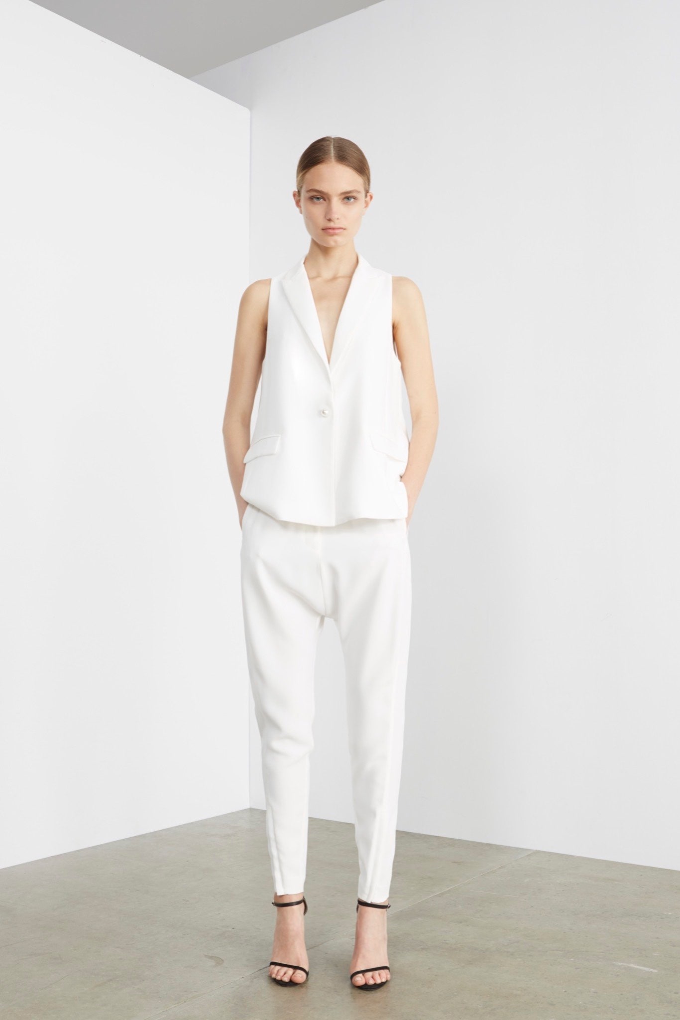 white sleeveless longline waistcoat