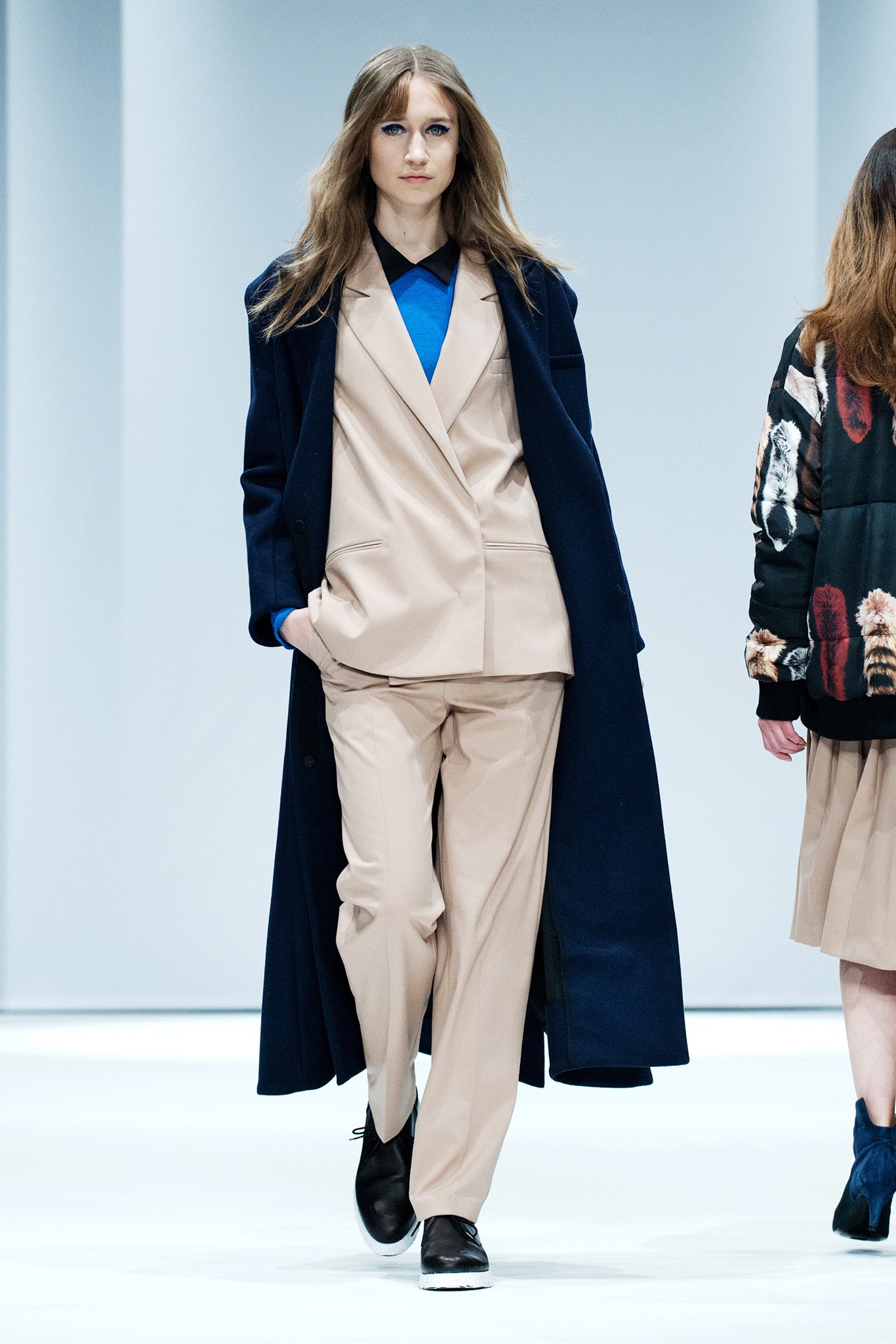 beige wrap-front sleeveless blazer