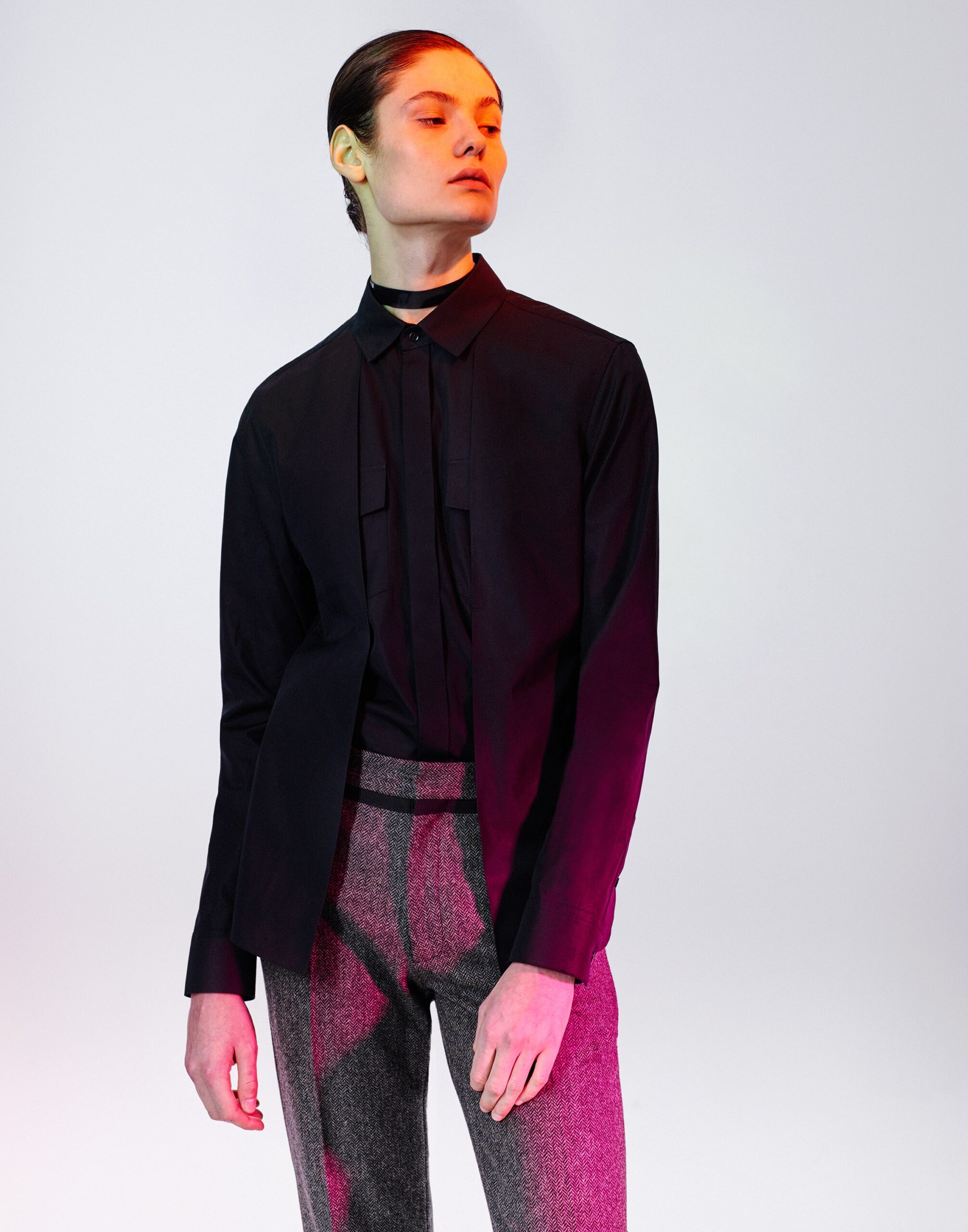 black bib-front shirt with skinny tie