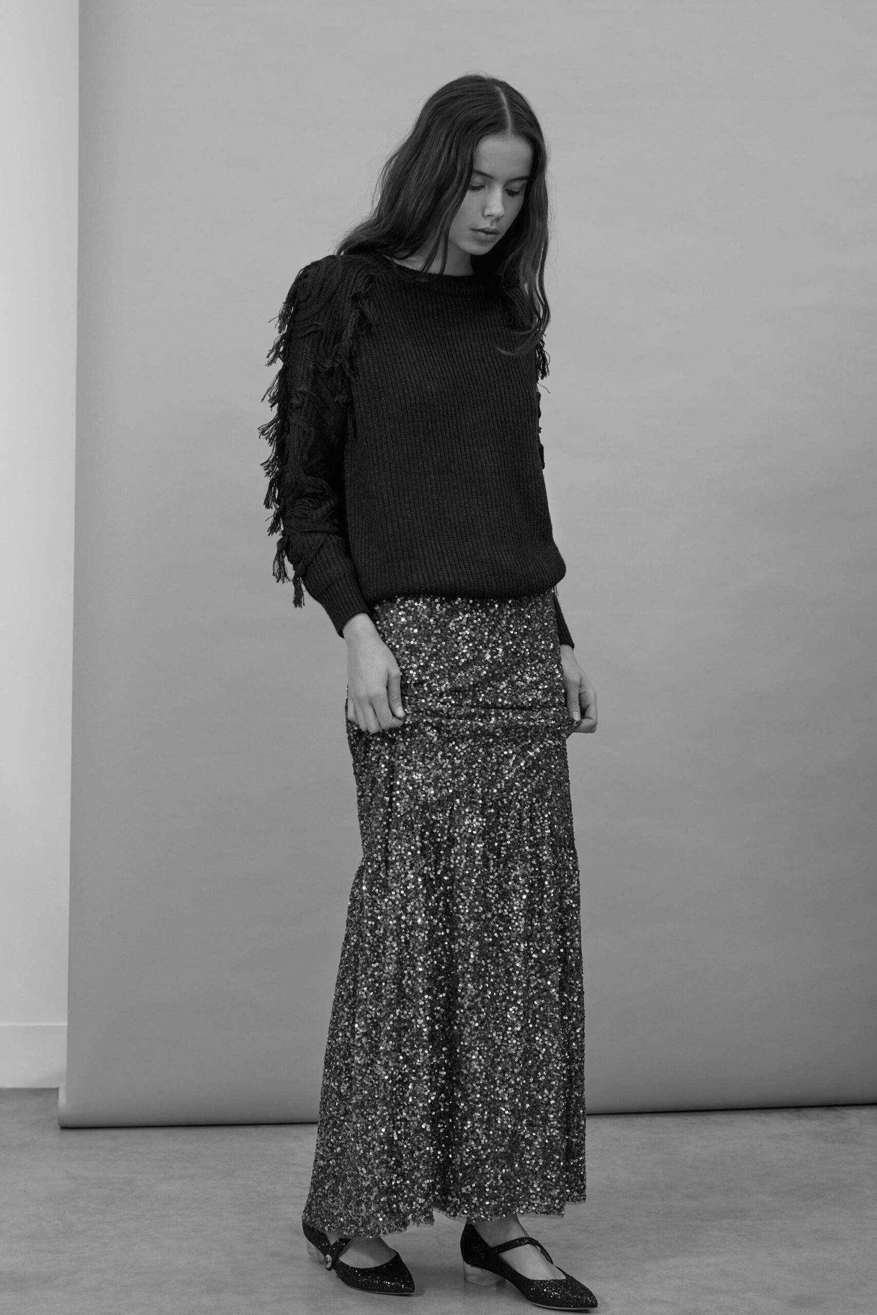 black fringed knit sweater