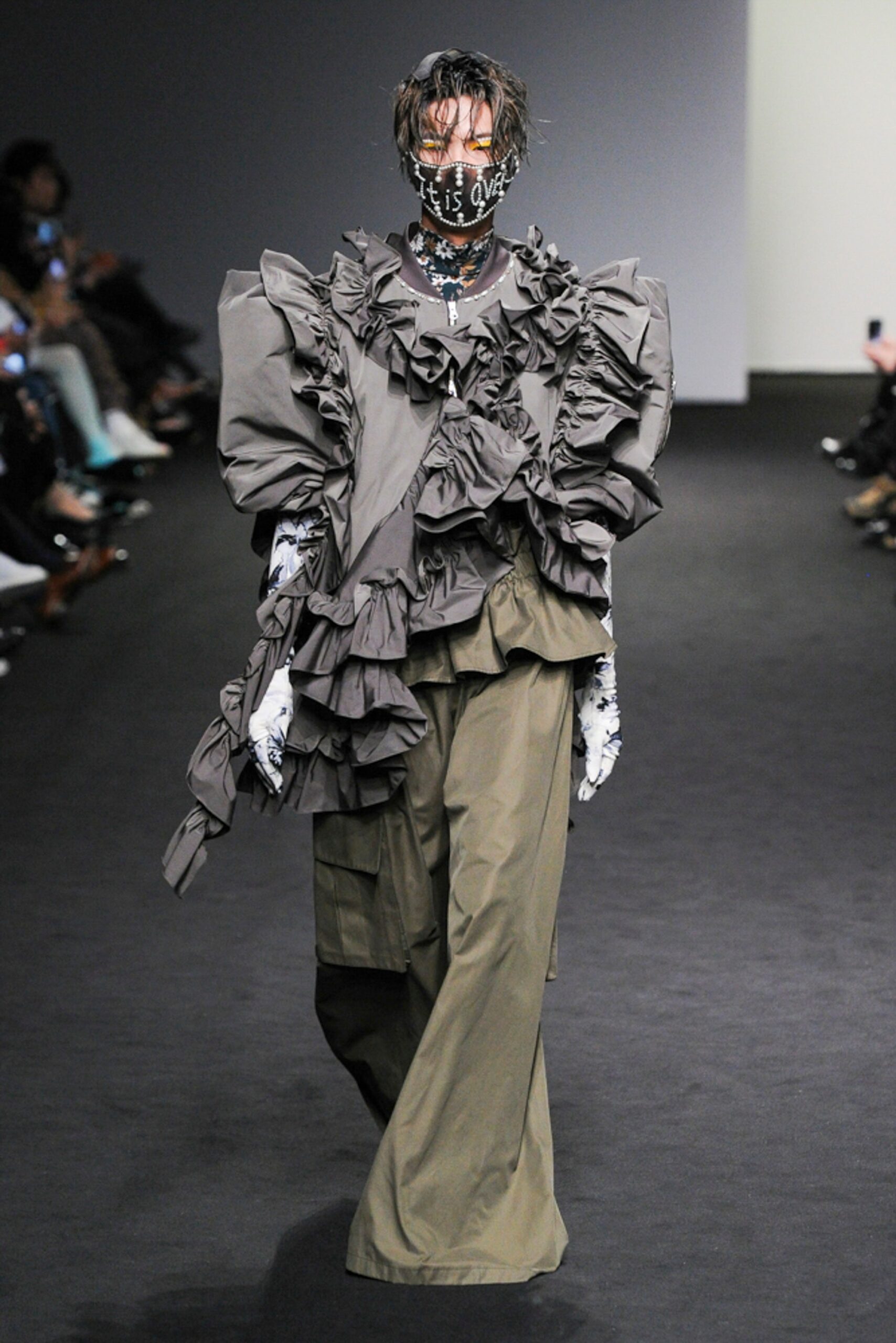 gray ruffled high-neck blouse