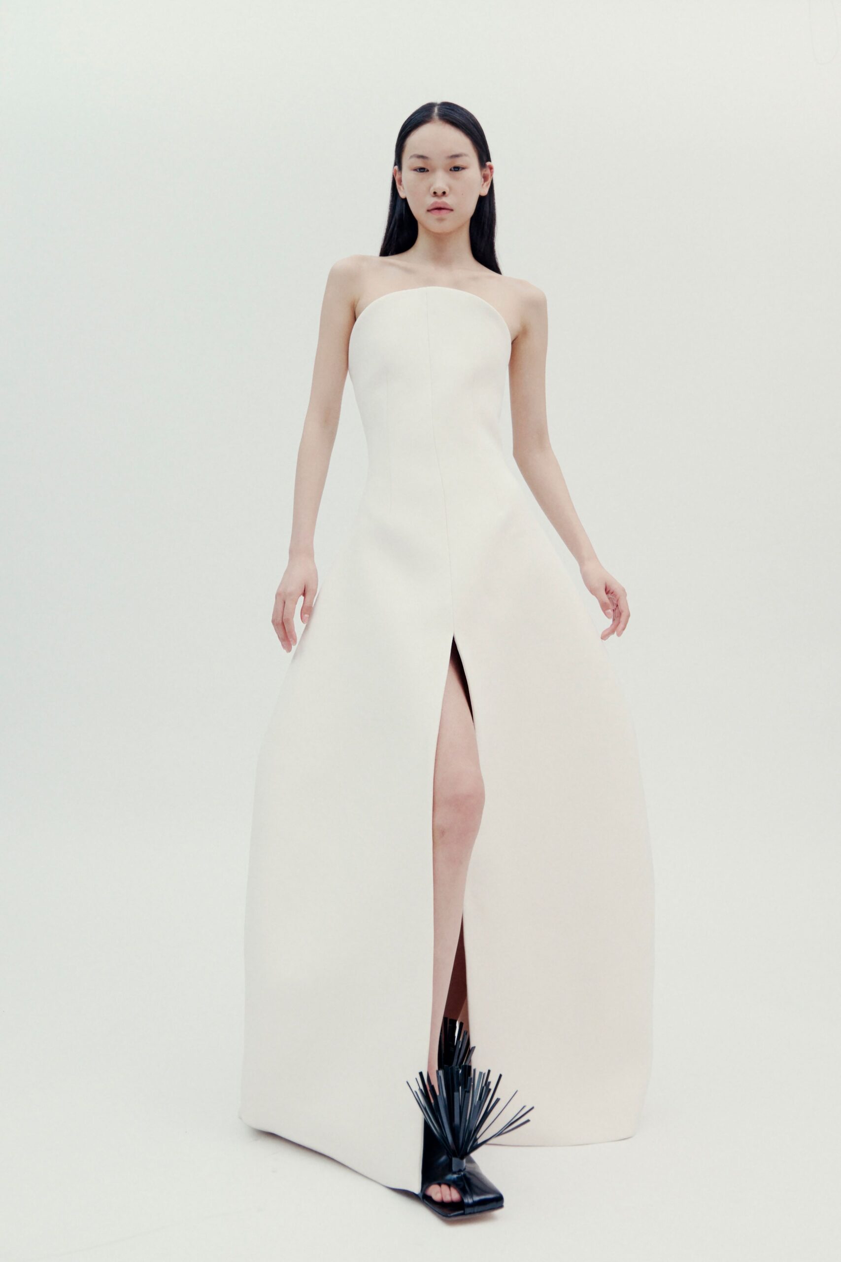 white strapless gown with slit