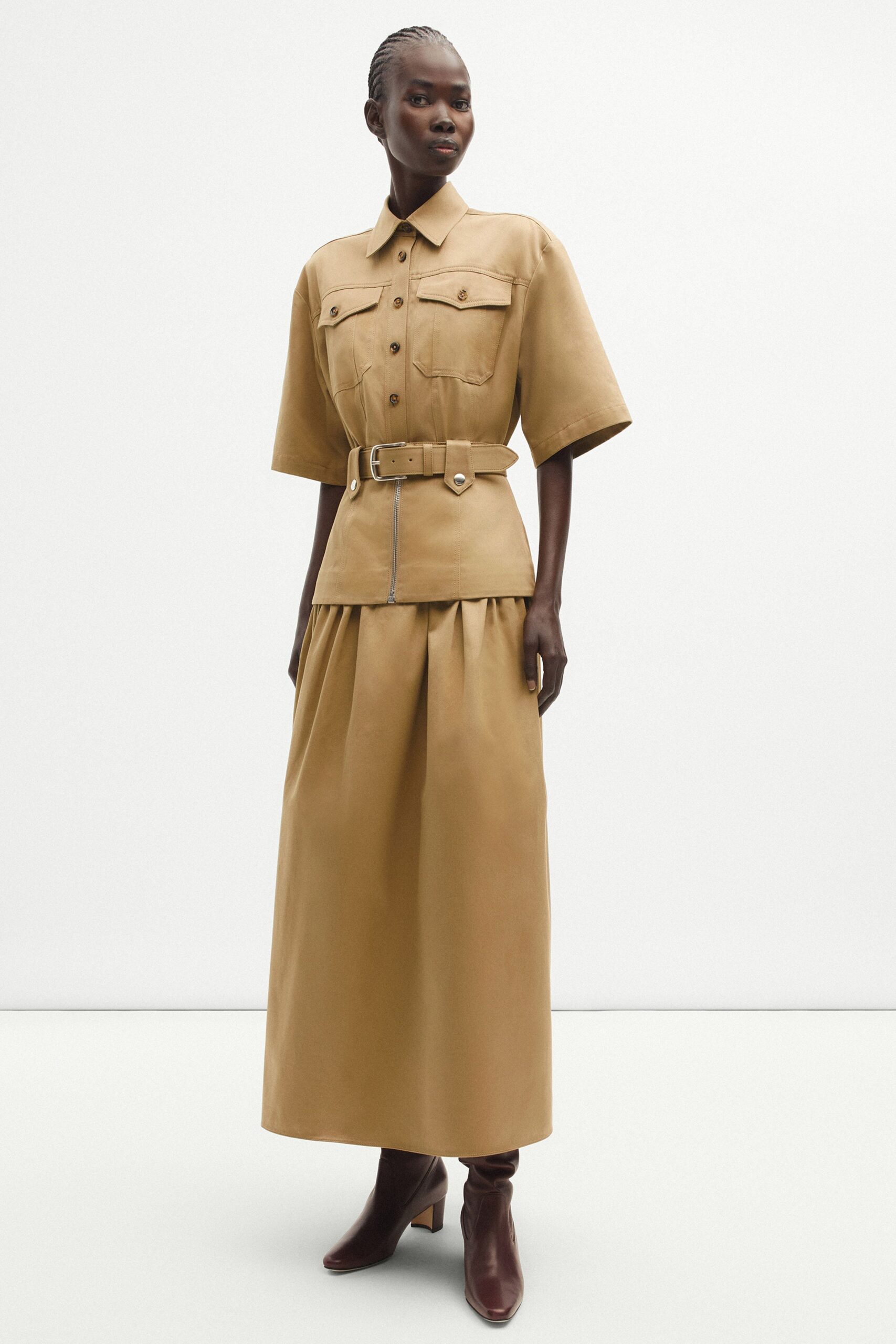 beige leather short-sleeve collared fitted belted pleated dress