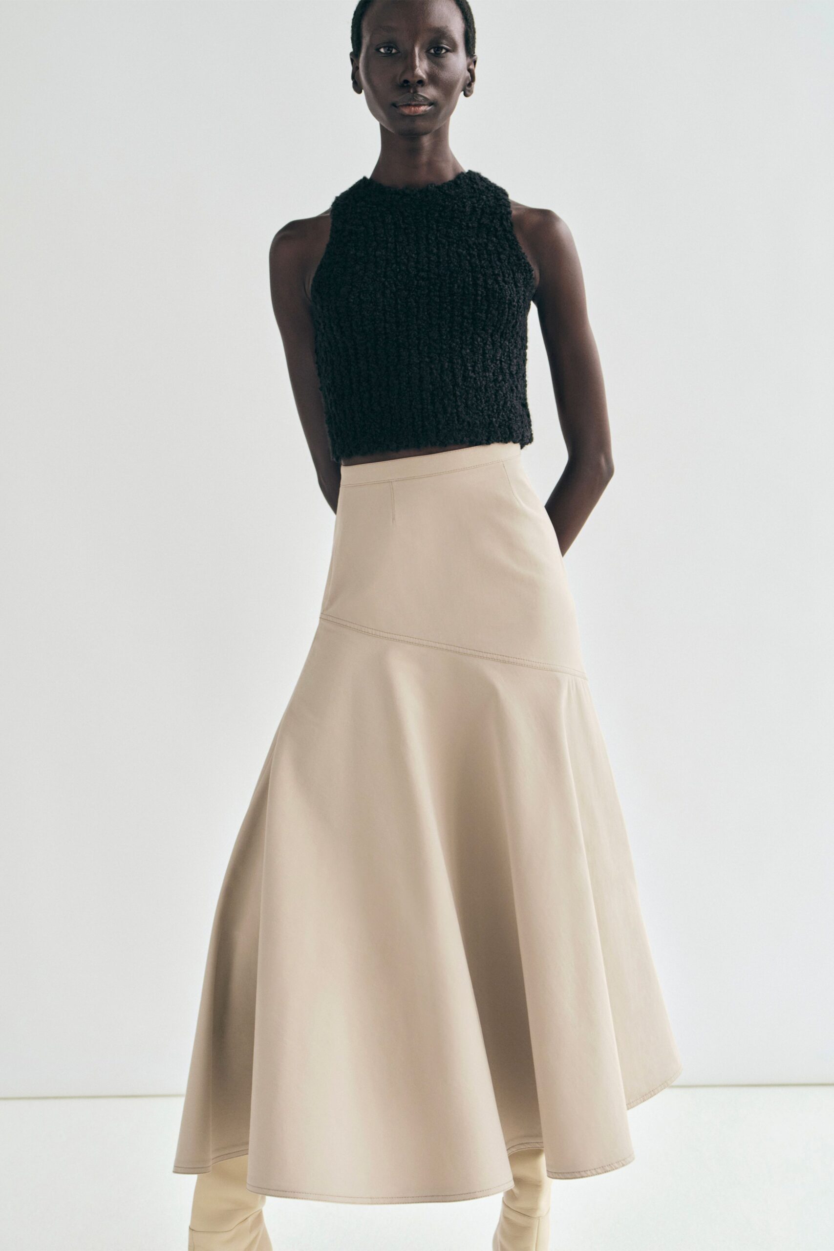 beige leather fitted flared midi skirt