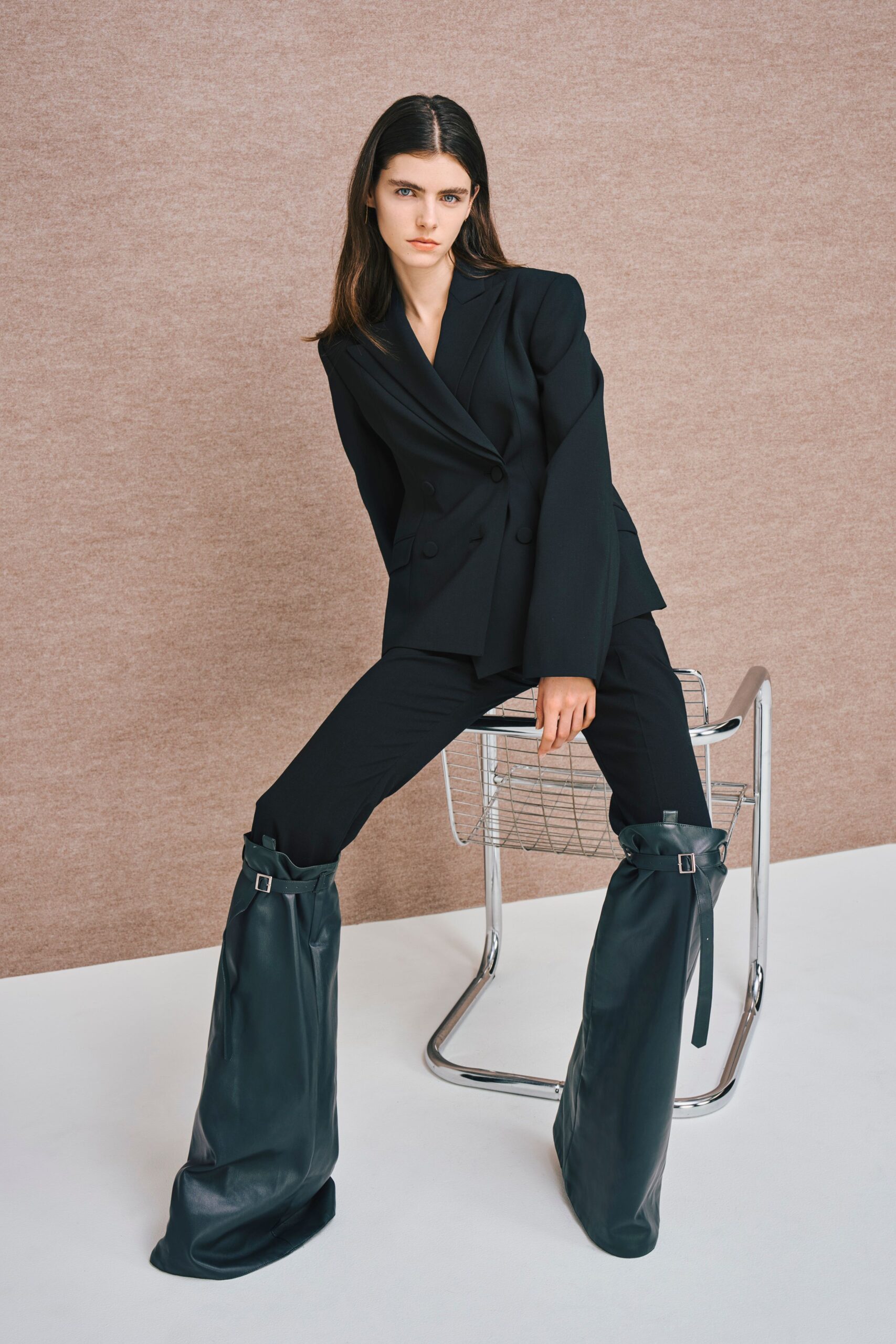black tailored blazer with green boots