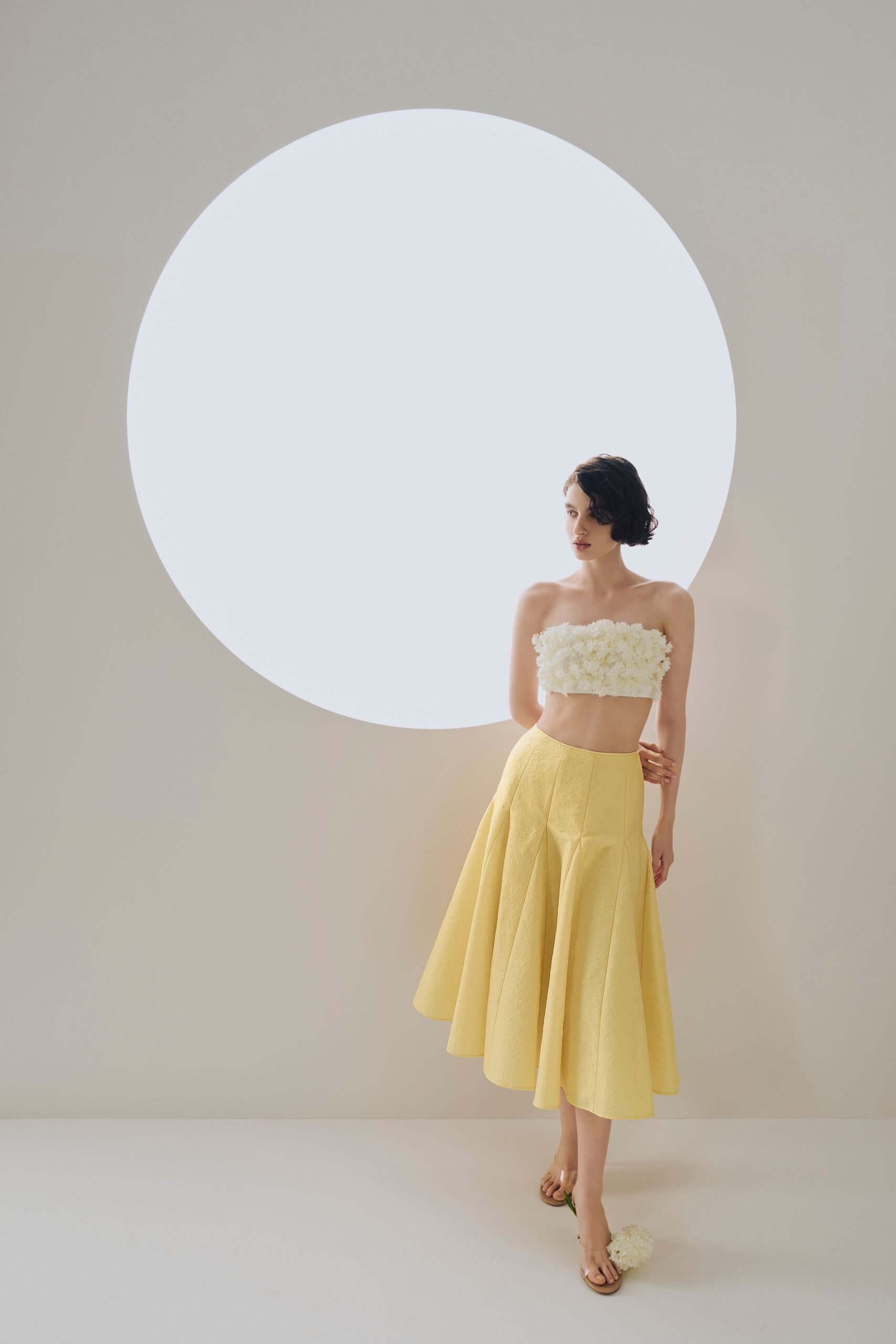 white embellished crop top and yellow flared skirt
