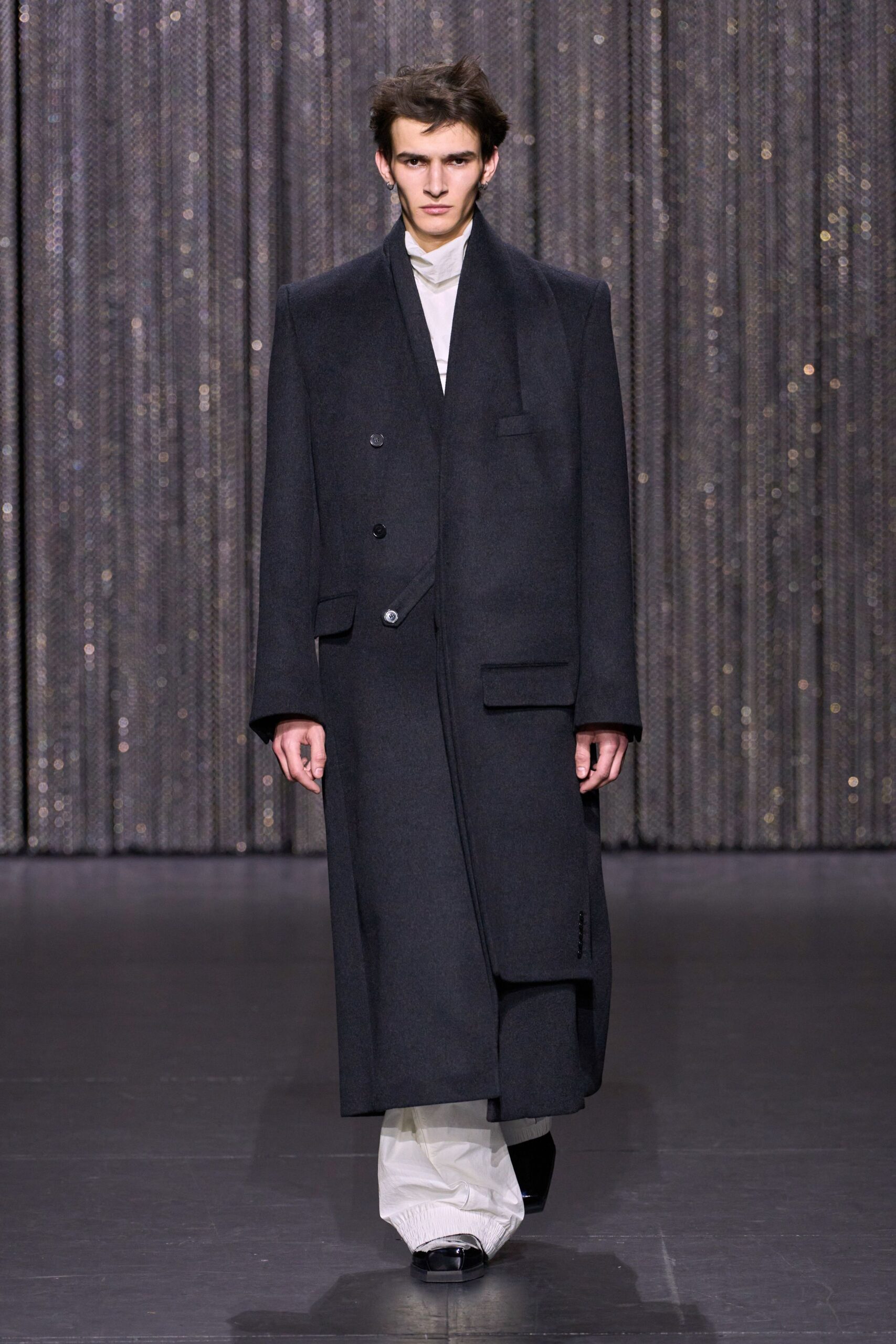 black wool coat with white pants
