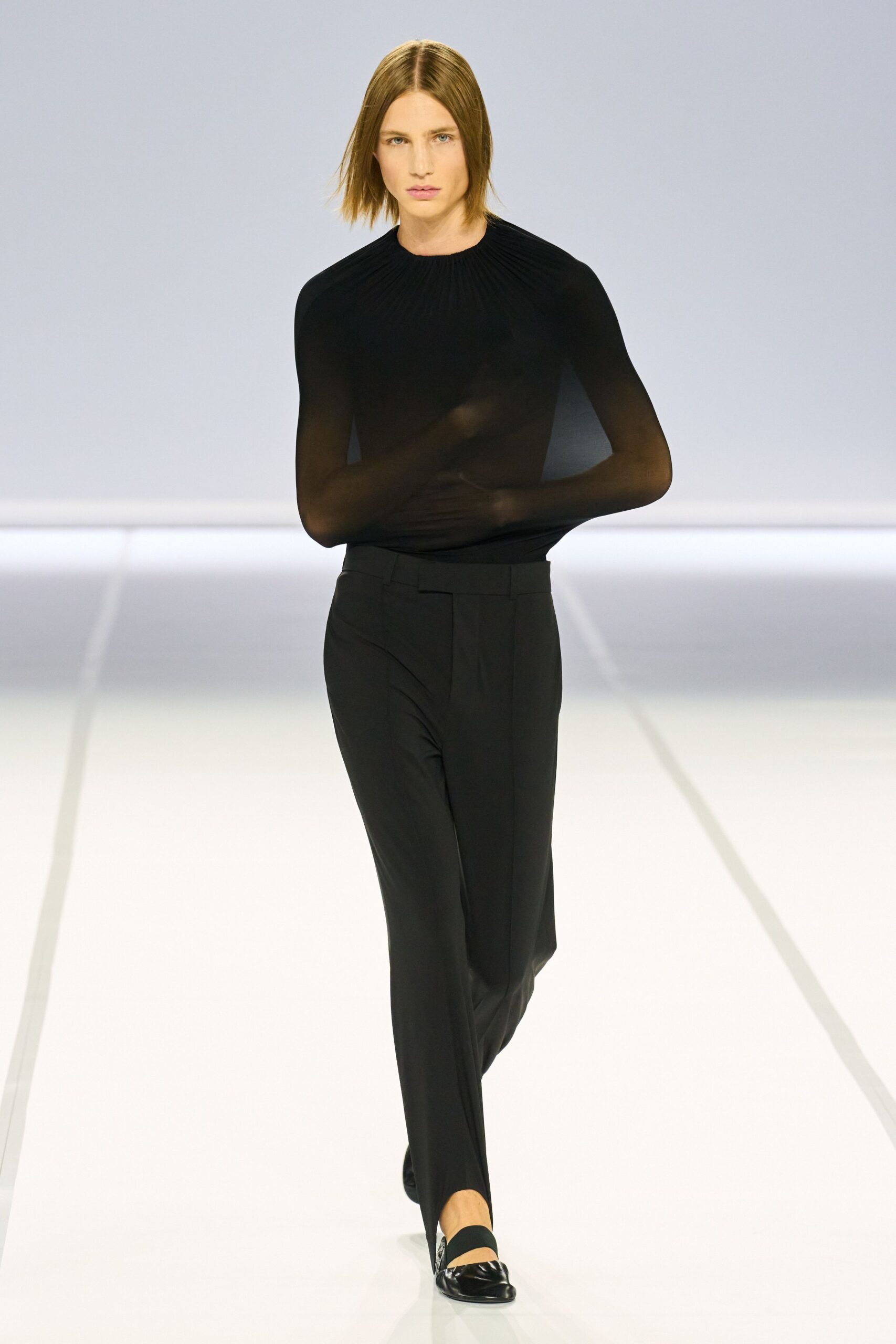 black fitted top and tailored pants