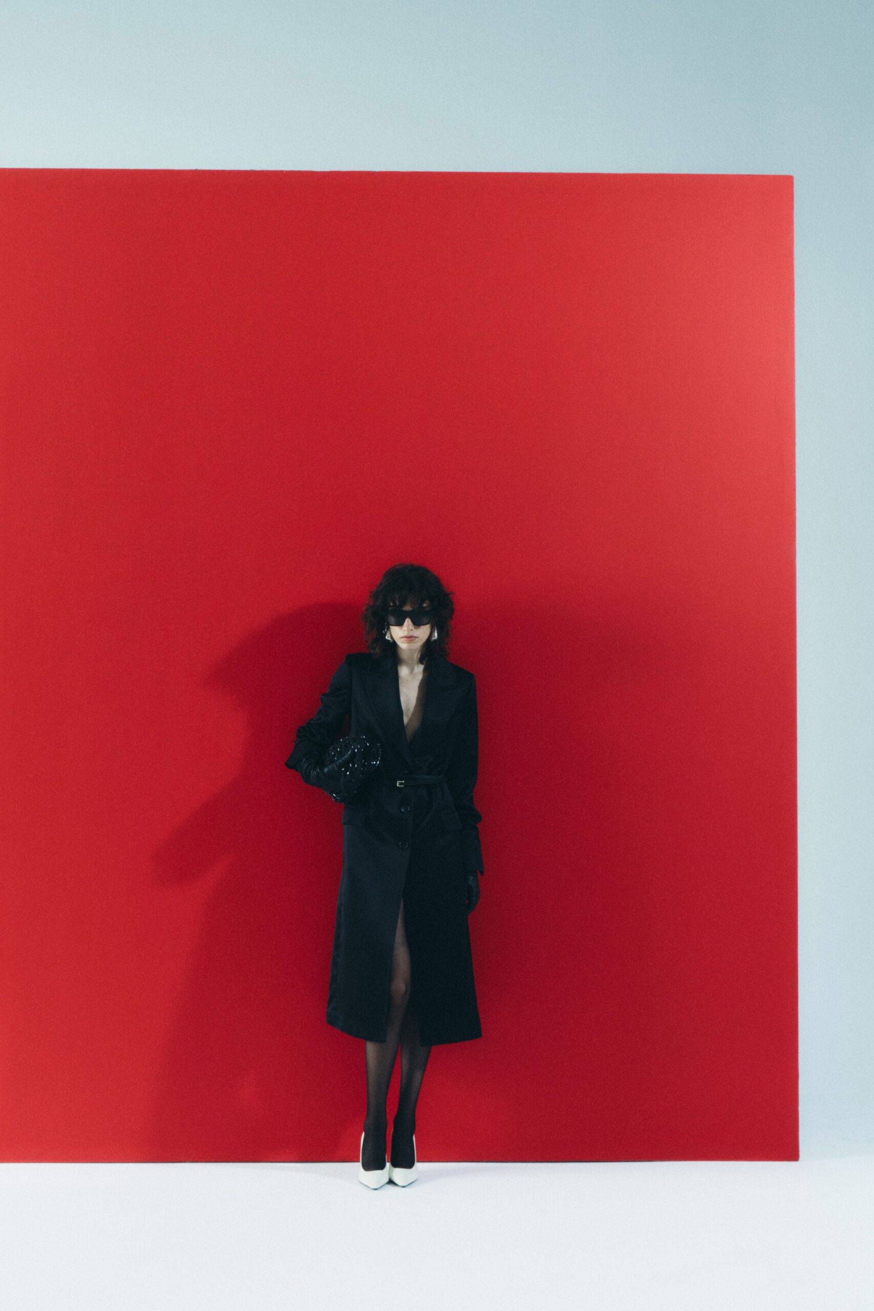 black fitted coat with sunglasses