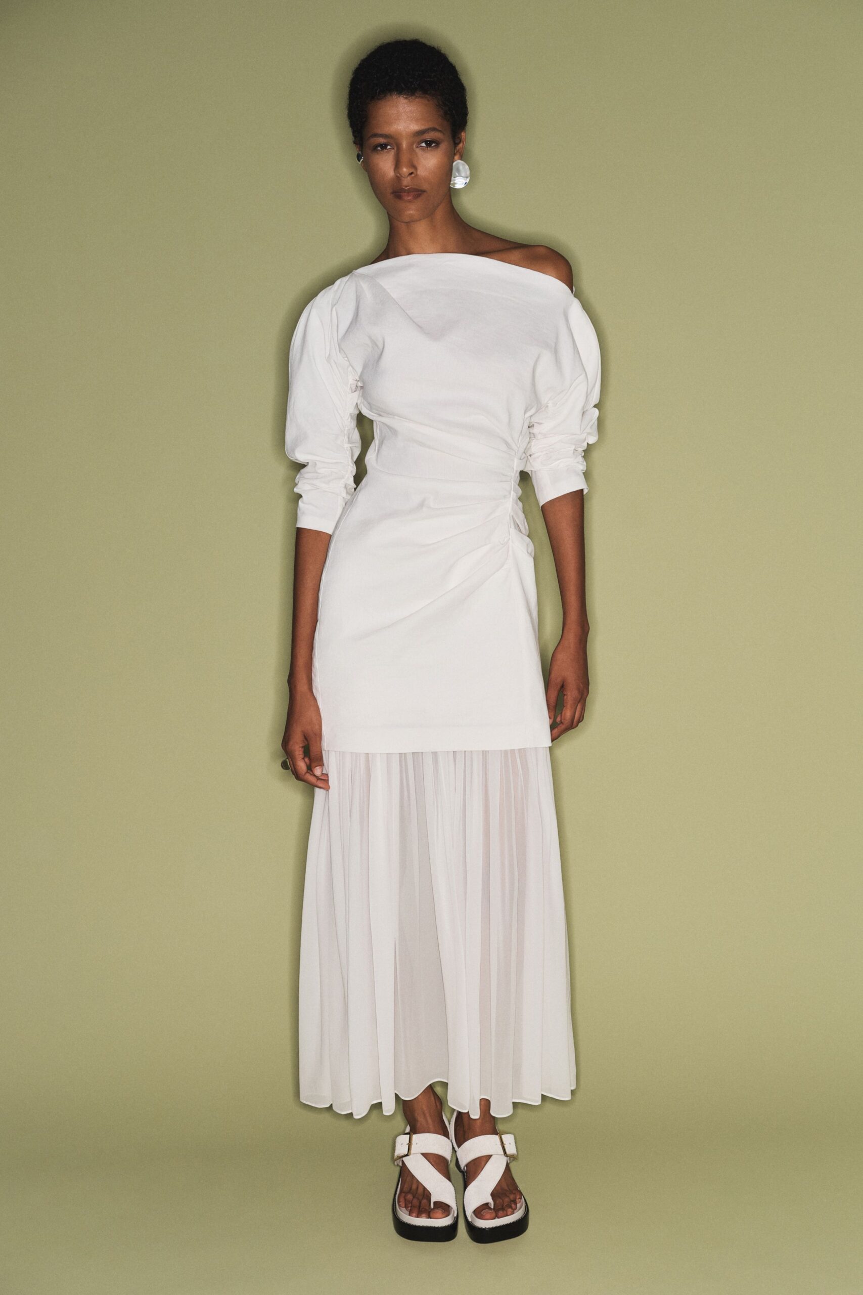 white off-shoulder midi dress with strappy shoes