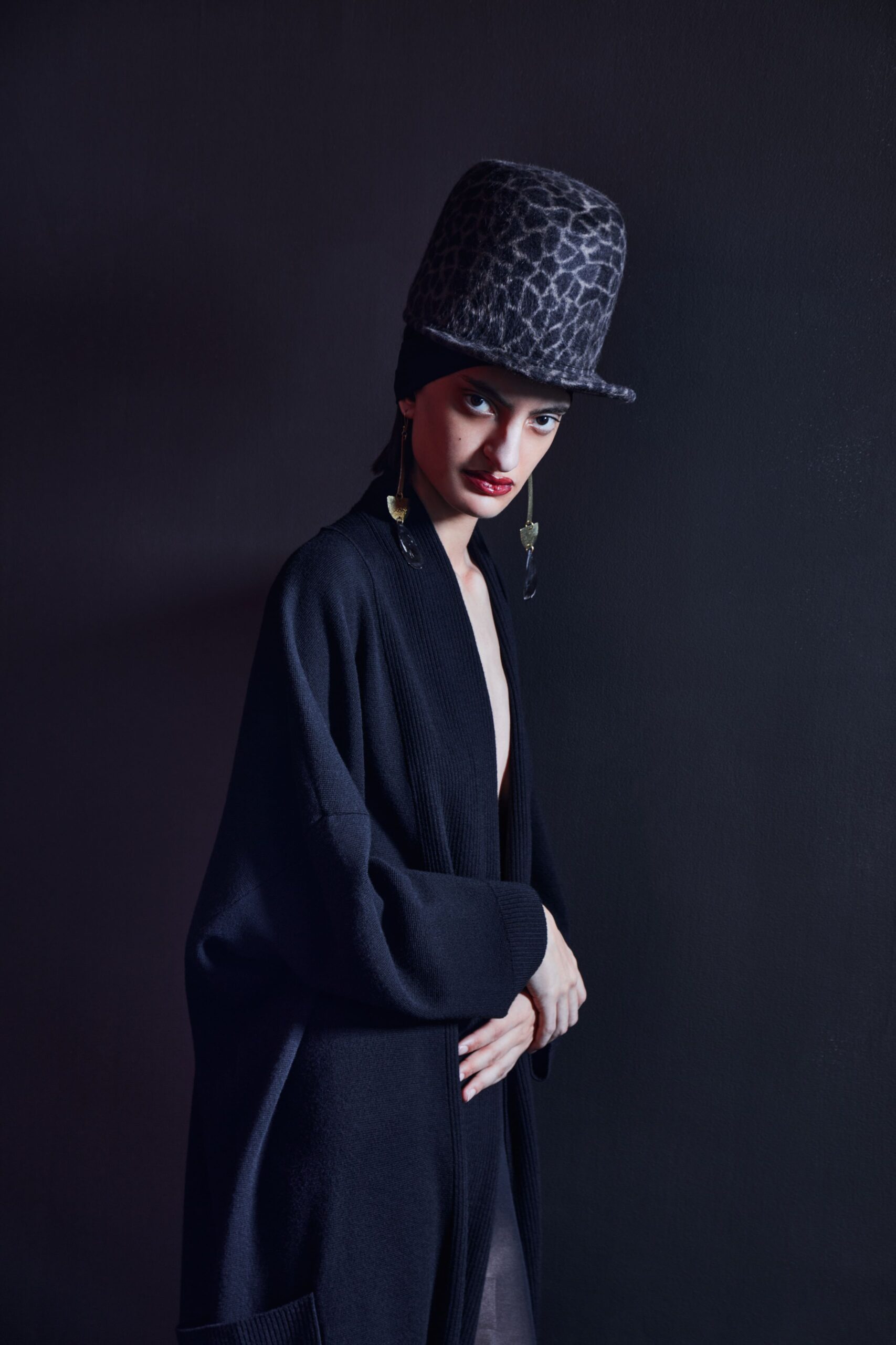 black wool cardigan with animal-print hat