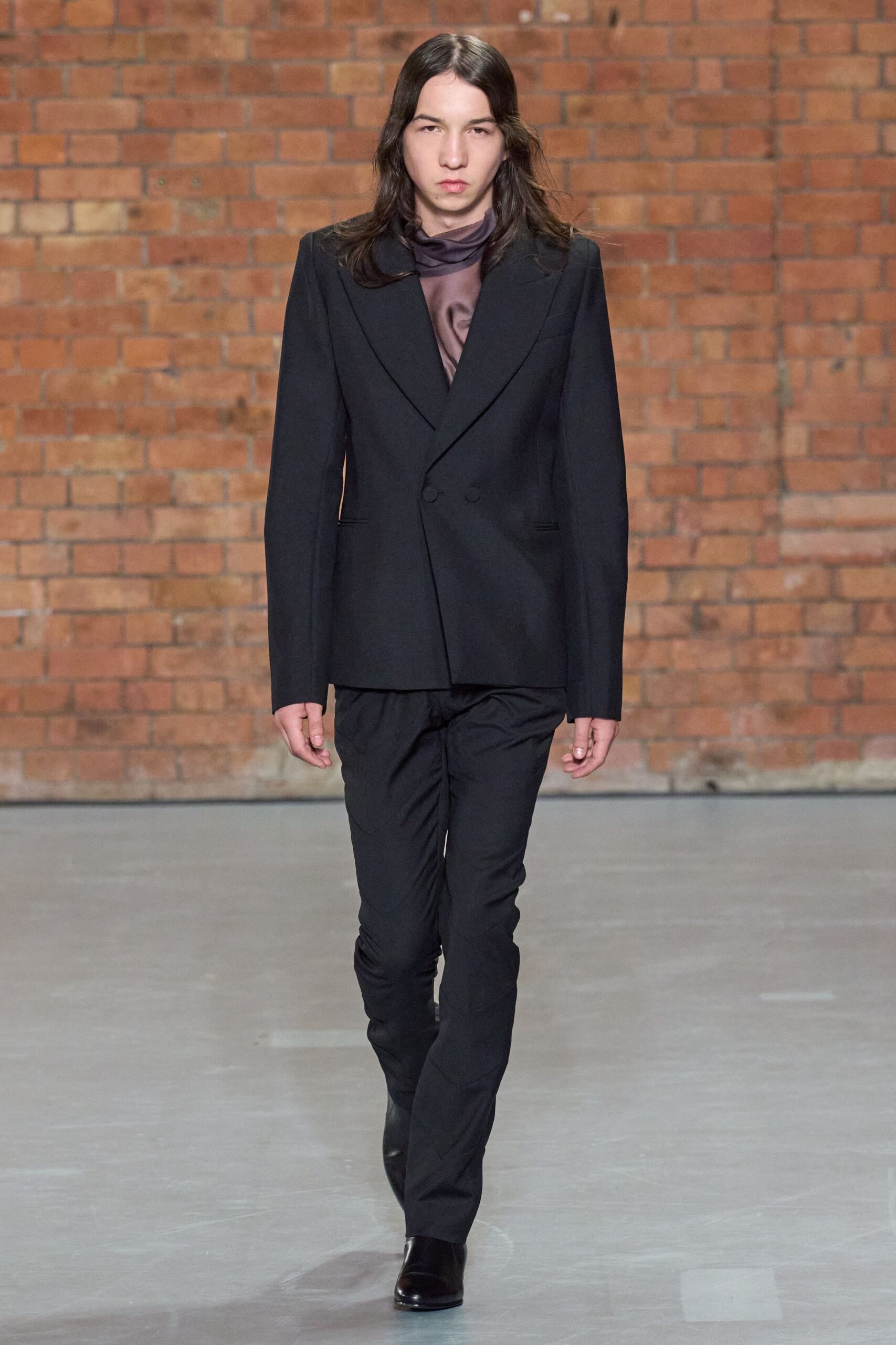 black tailored suit with scarf