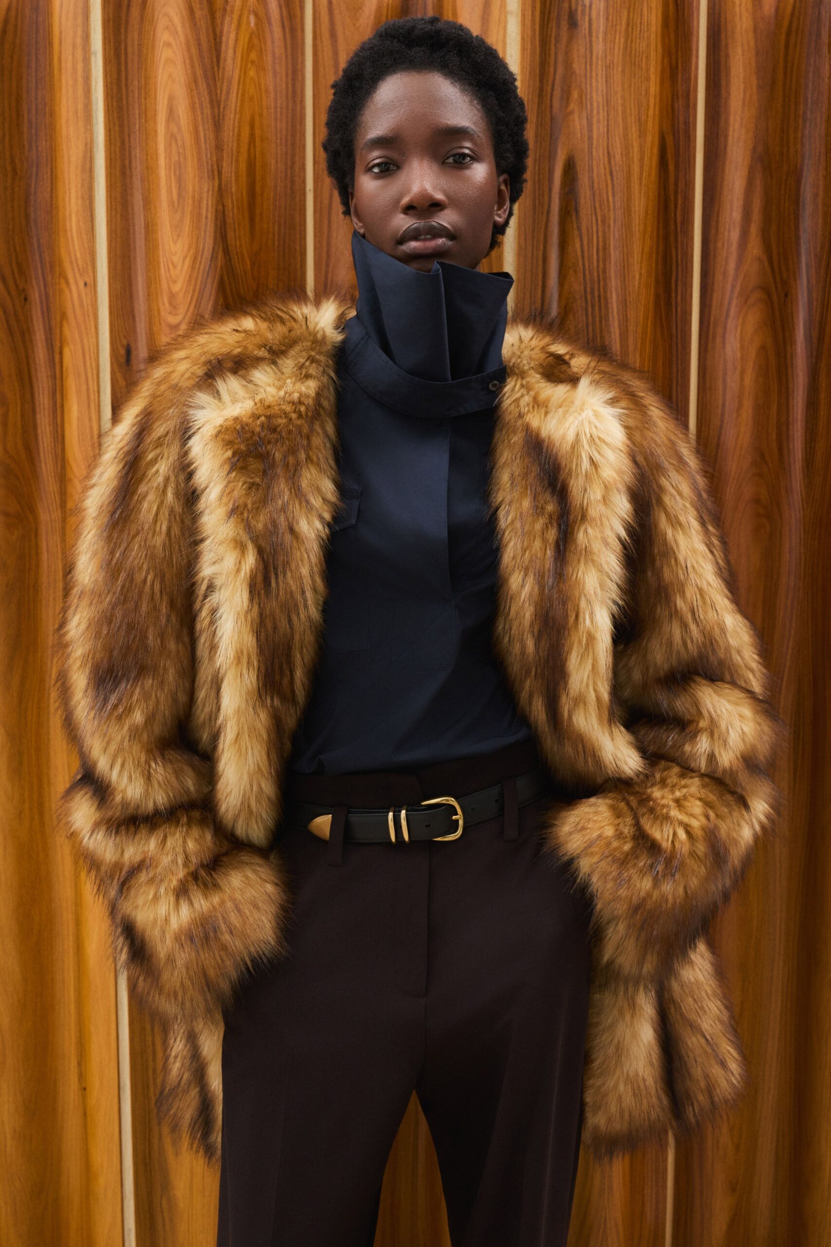 brown faux-fur coat with black shirt