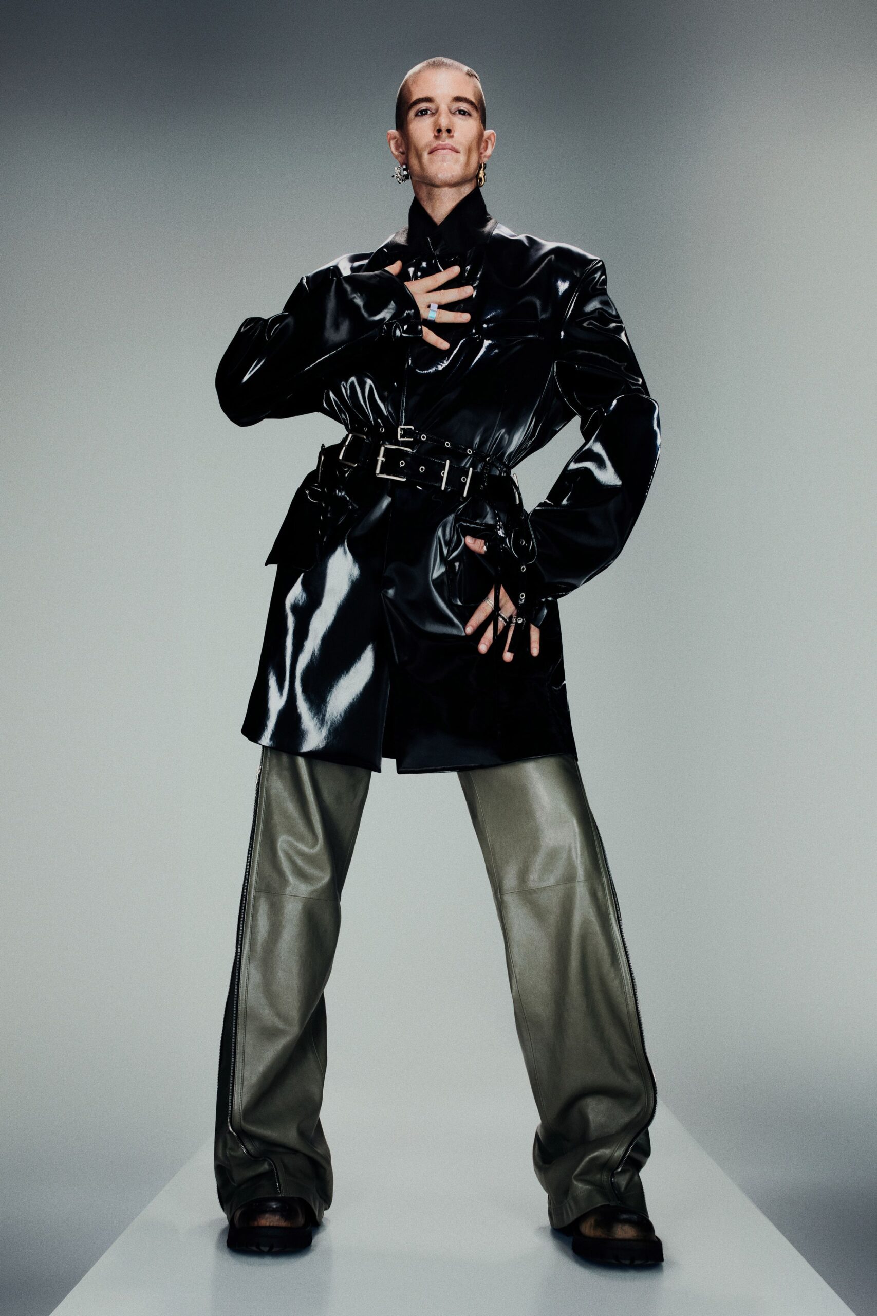 black vinyl long-sleeve collared fitted zippered belted jacket