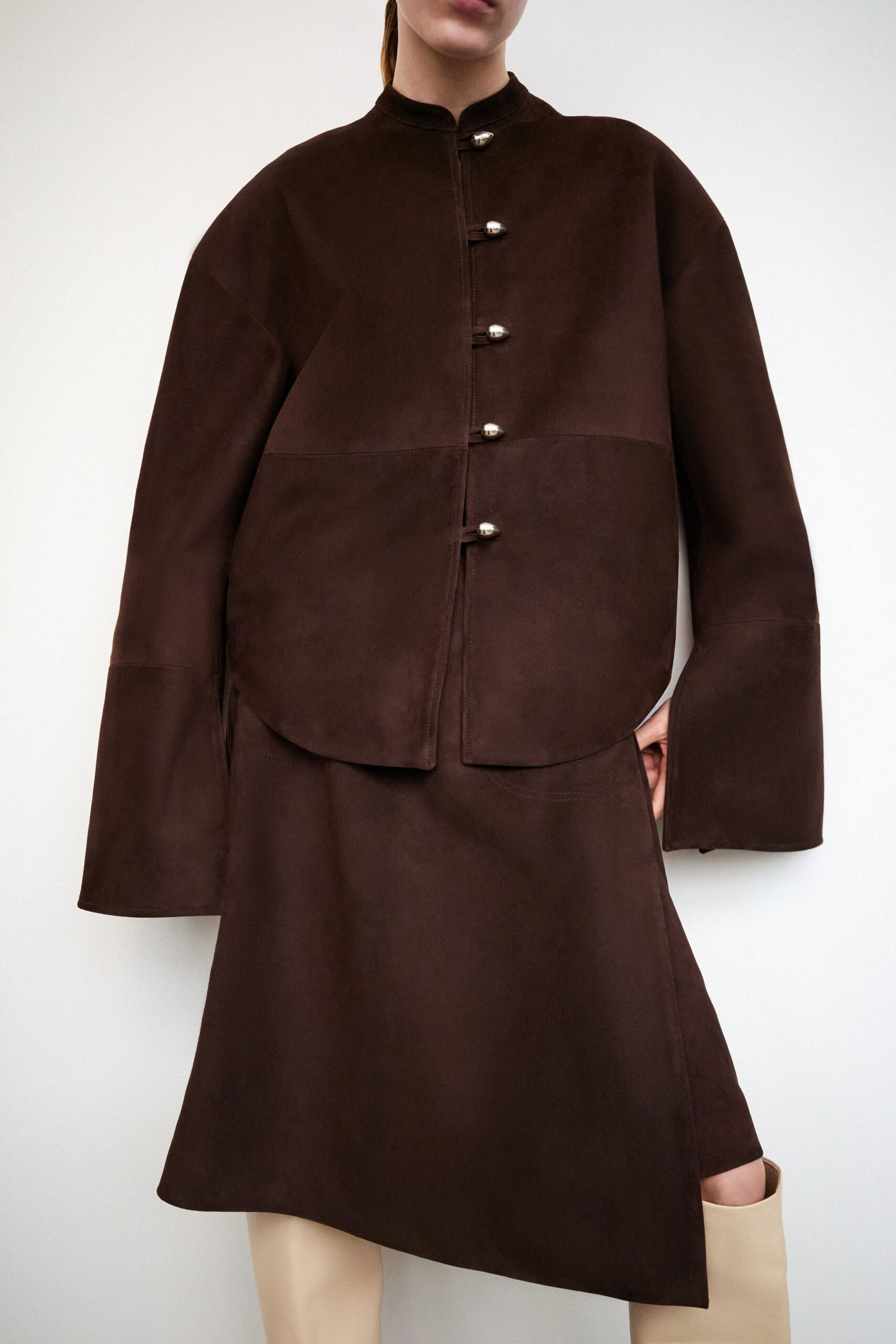 brown suede relaxed jacket and fitted skirt
