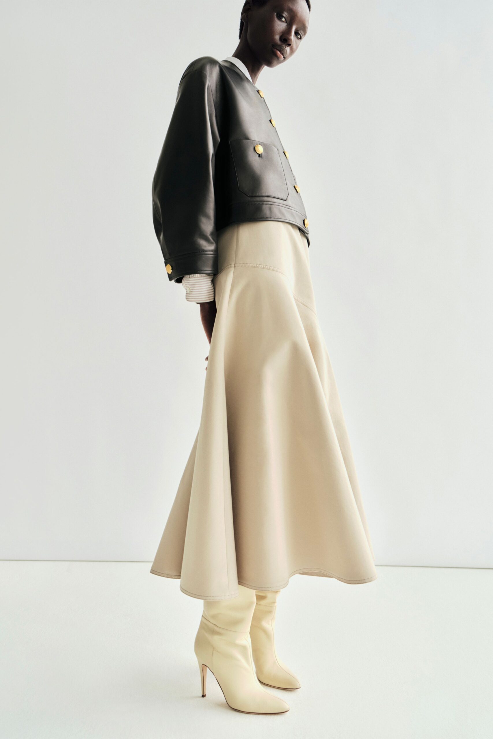 beige leather fitted flared midi skirt