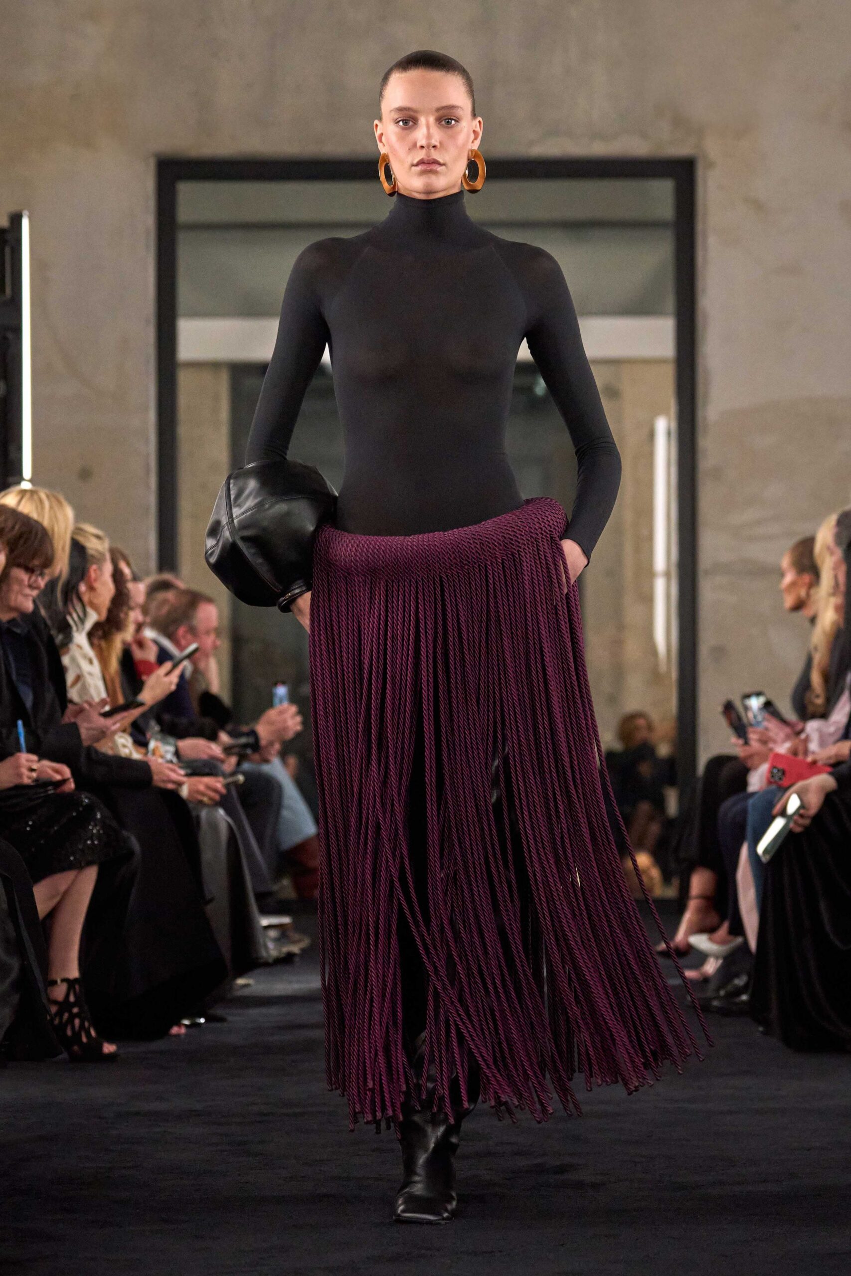 black fitted long-sleeve dress with fringes