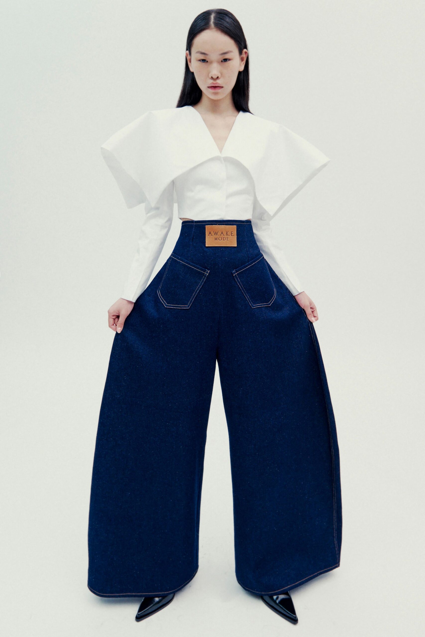 white pleated top blue wide-leg pants