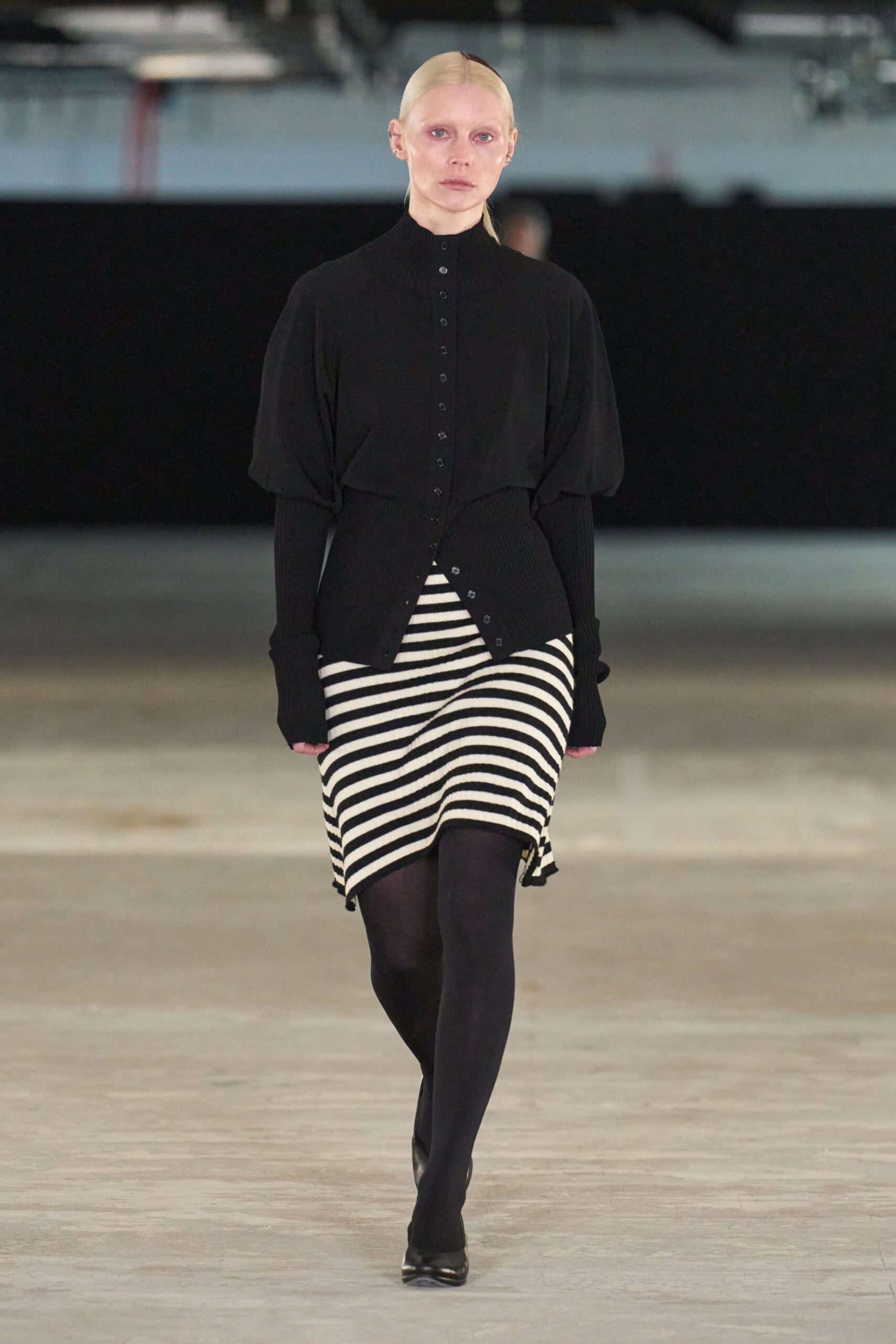black top with striped skirt