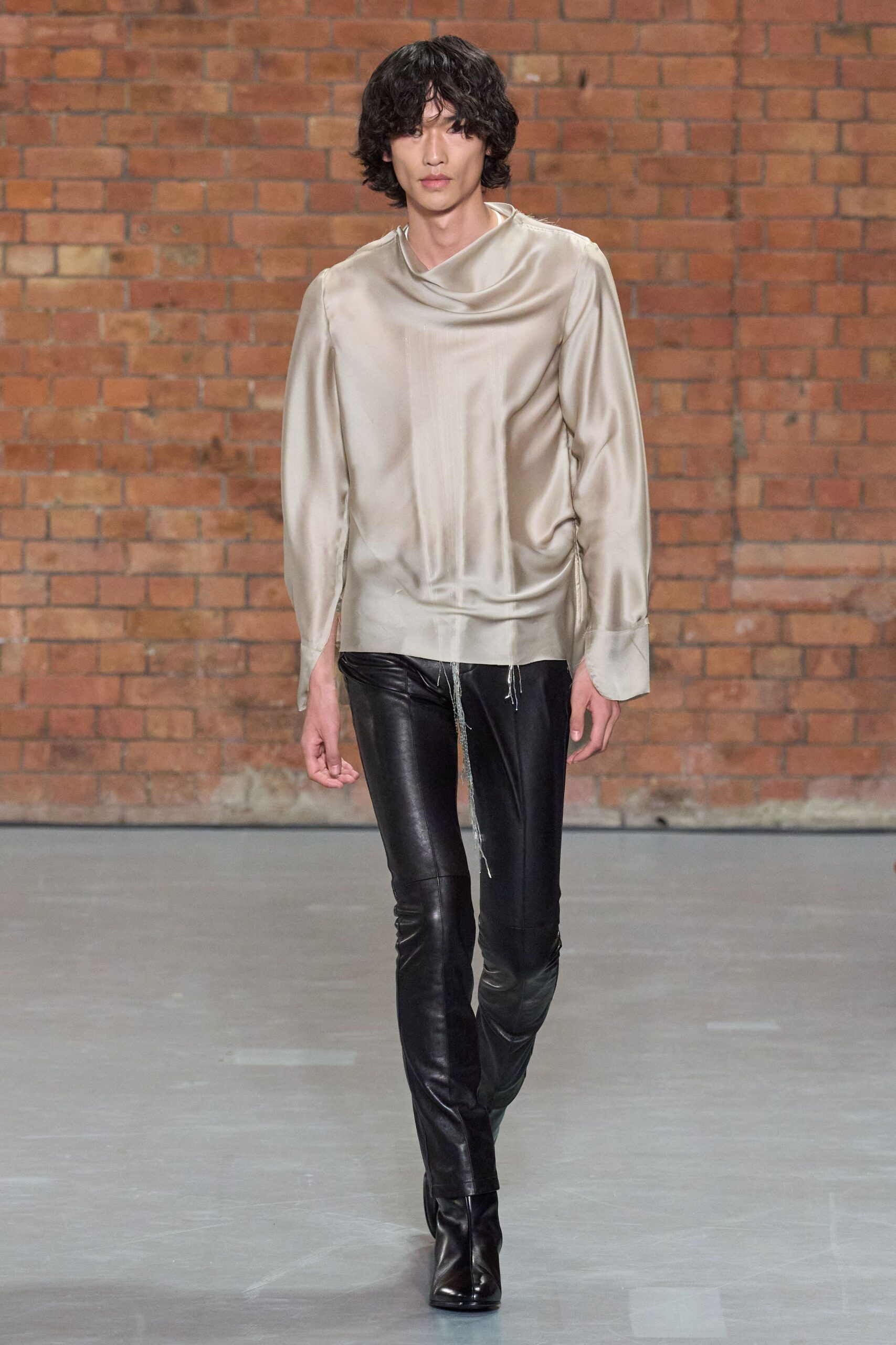 beige silk relaxed top with black leather pants
