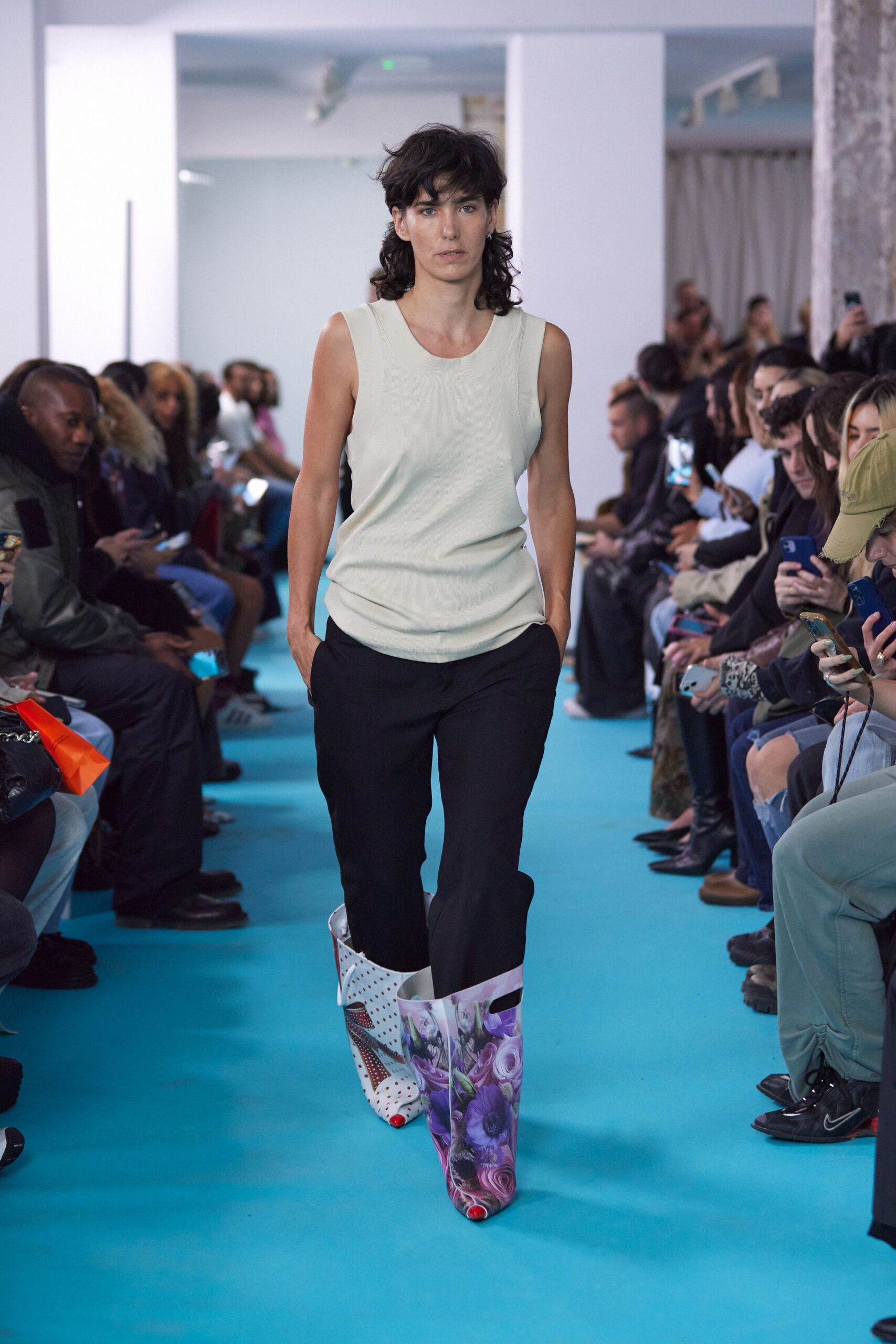 beige fitted top black relaxed pants floral boots