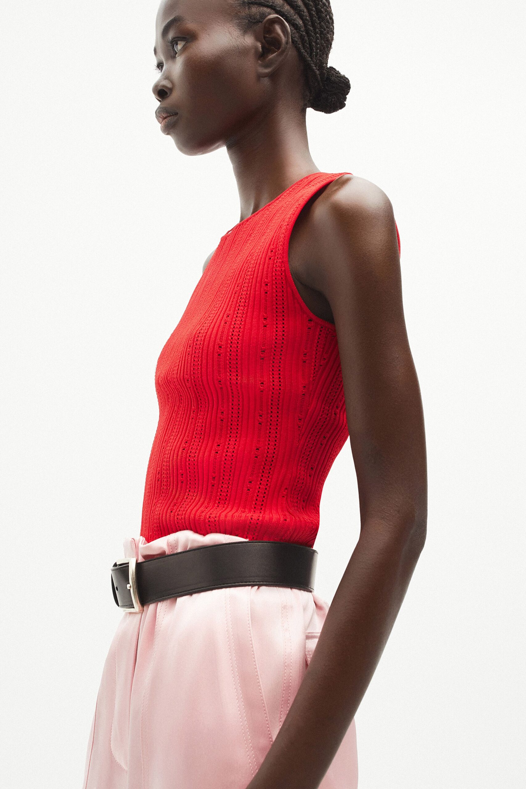 red fitted top with pink pants
