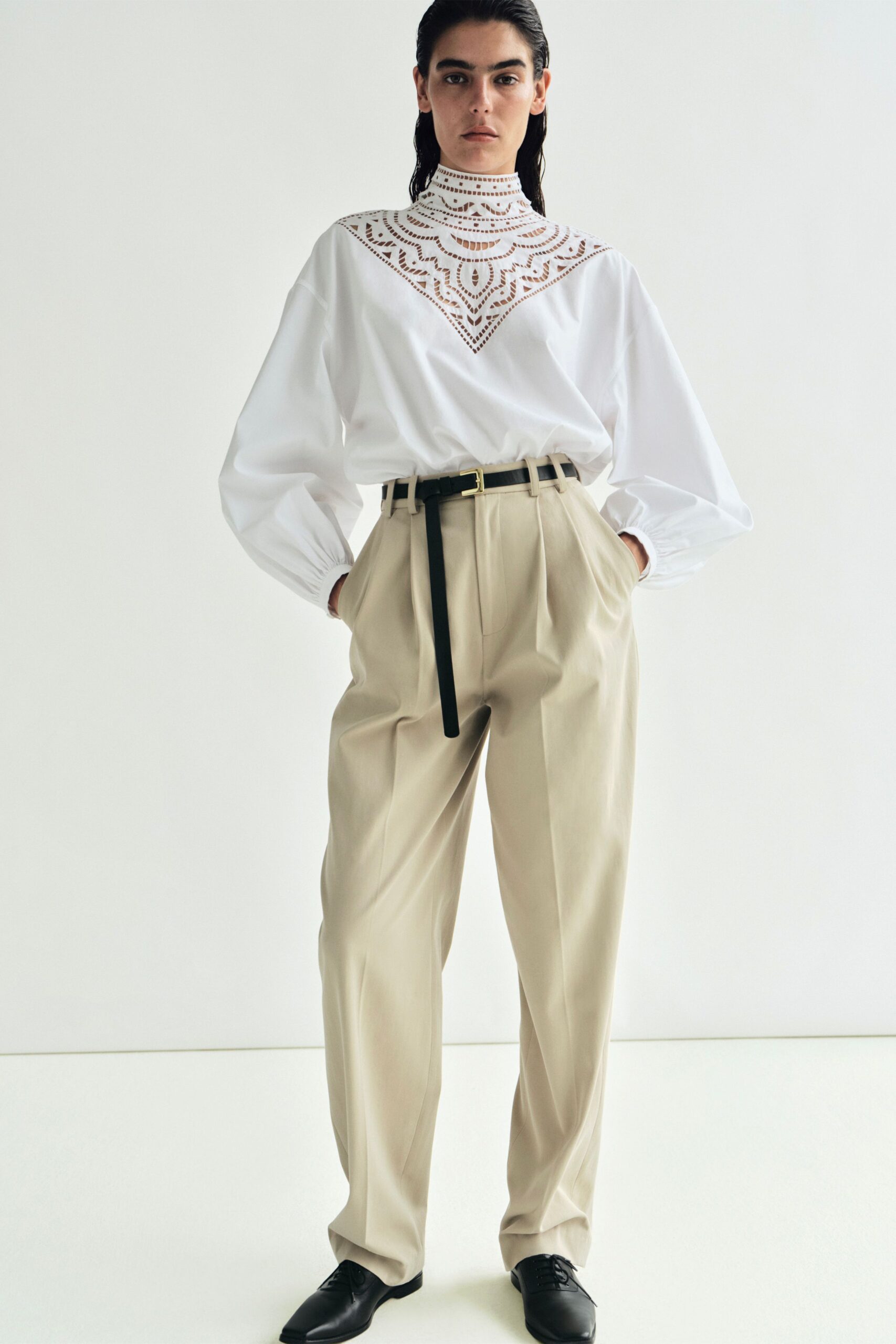 white embroidered shirt beige pants
