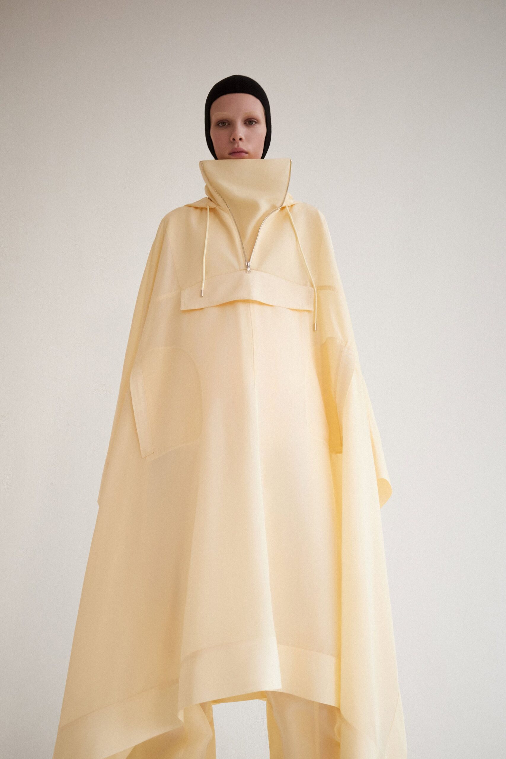 yellow cotton poncho with black hat
