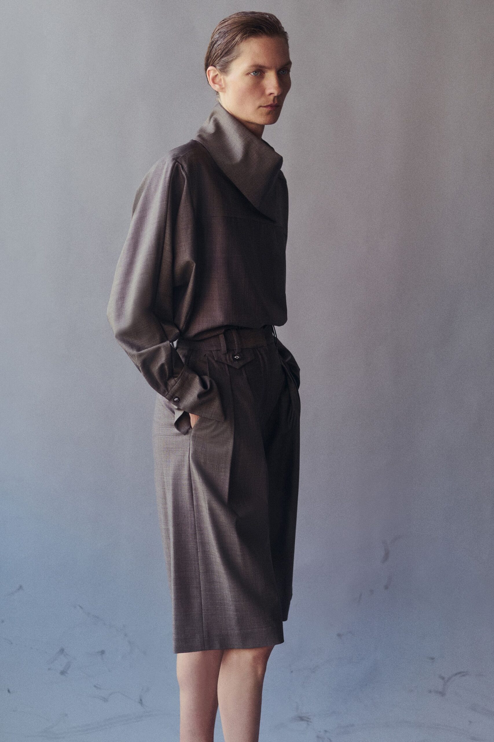 brown wool long-sleeve high-neck oversized draped buttoned blouse