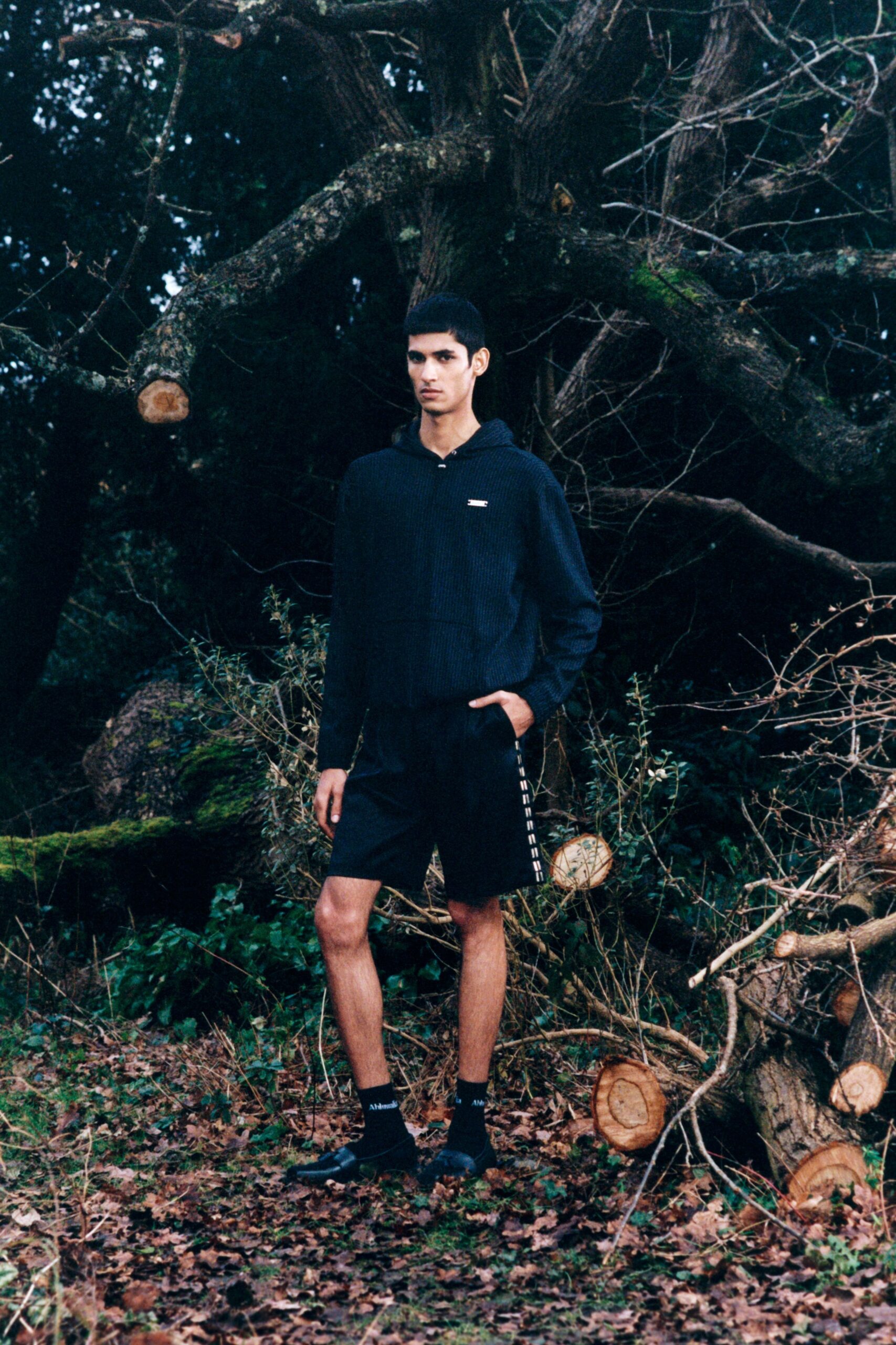 black hoodie and shorts outfit