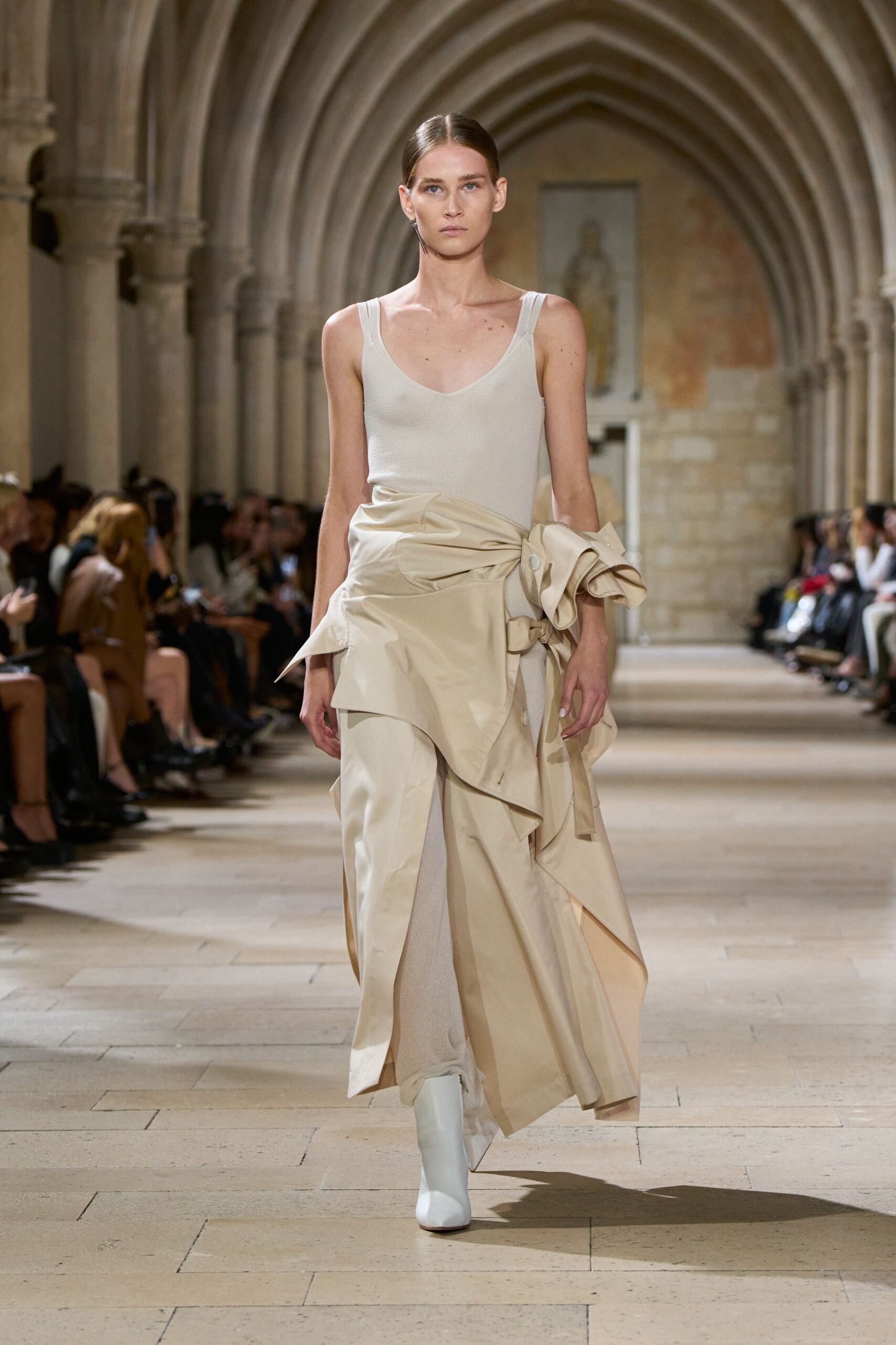 beige silk sleeveless dress with white shoes