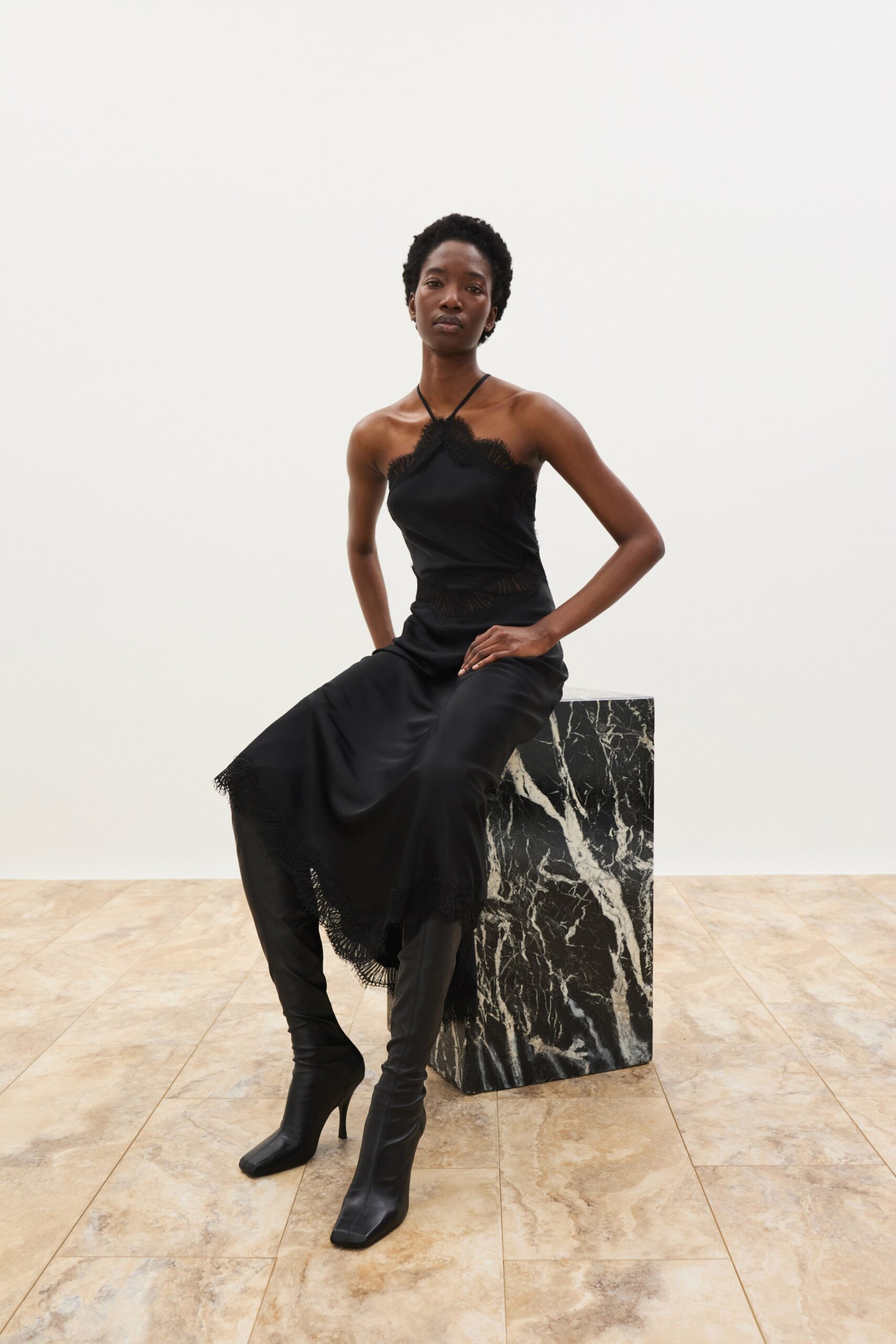 black silk sleeveless midi dress with boots