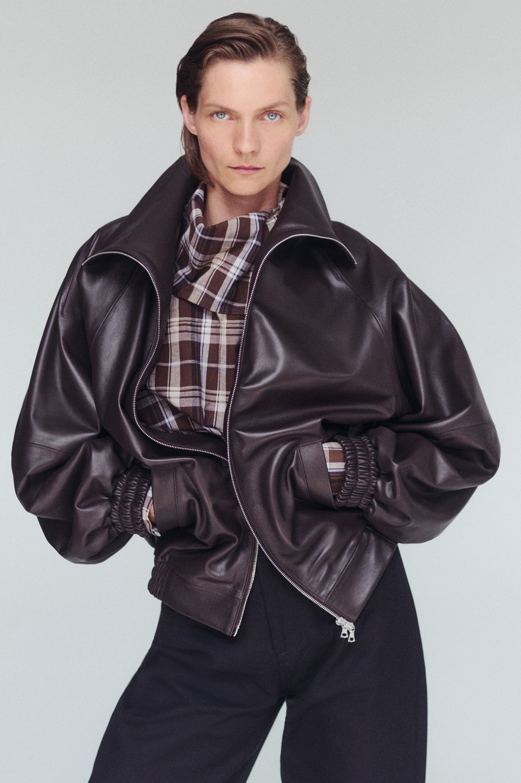 brown leather long-sleeve high-neck oversized zippered pockets jacket