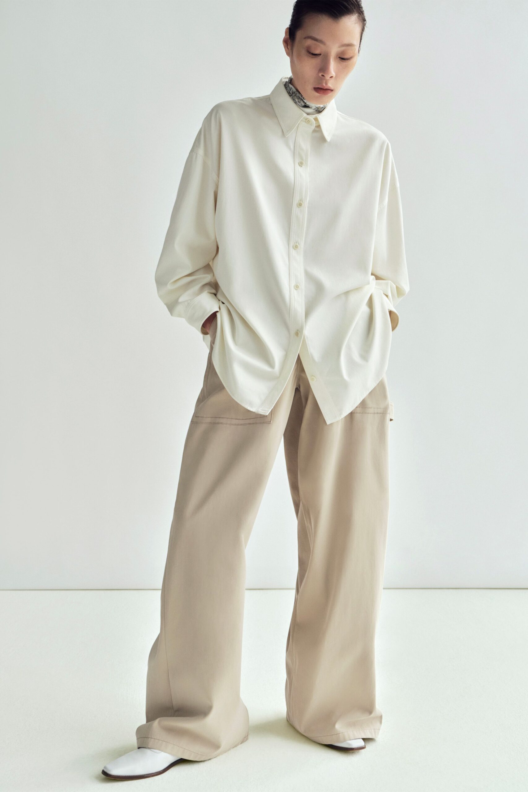 white oversized shirt beige relaxed pants