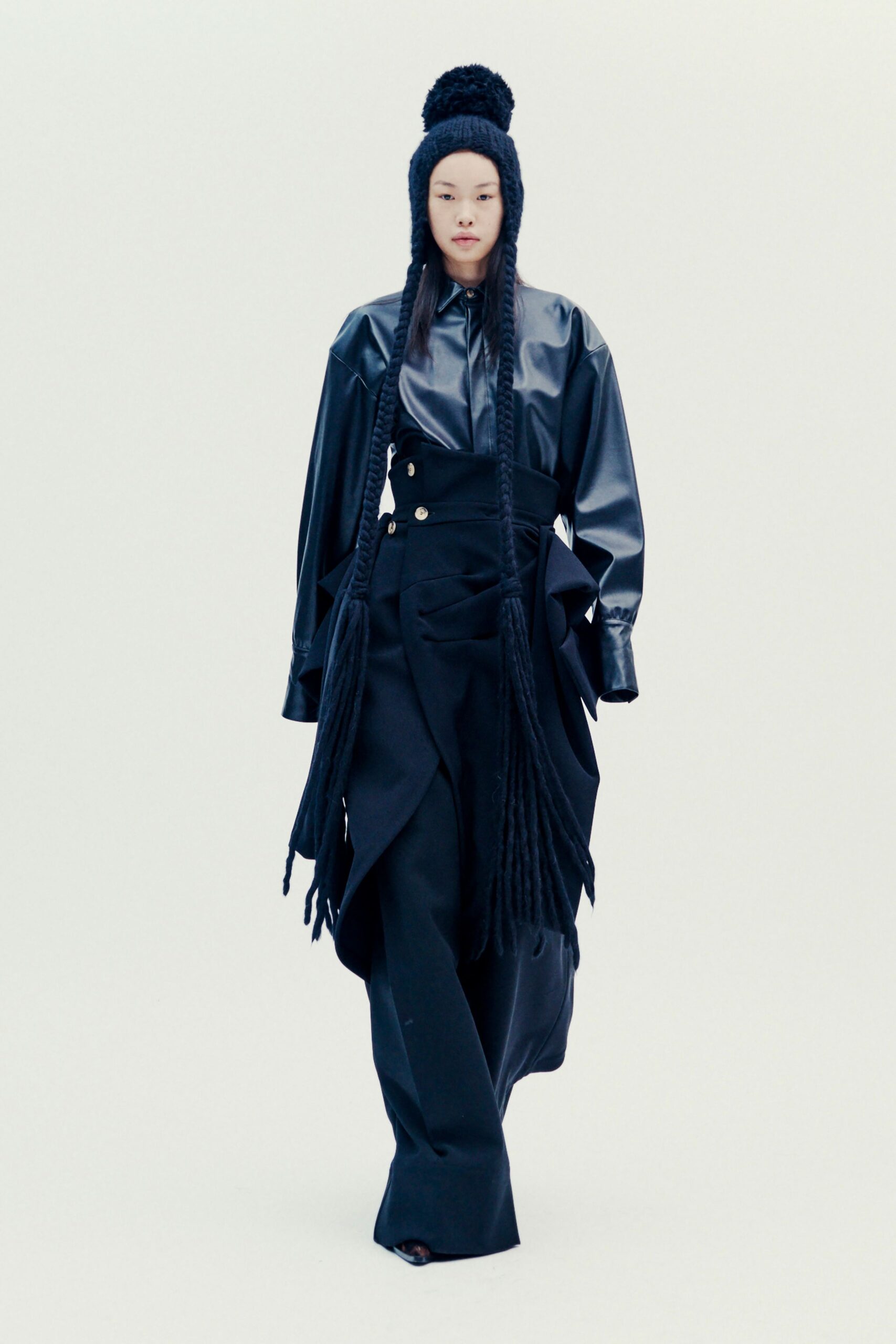 black leather shirt and flared pants