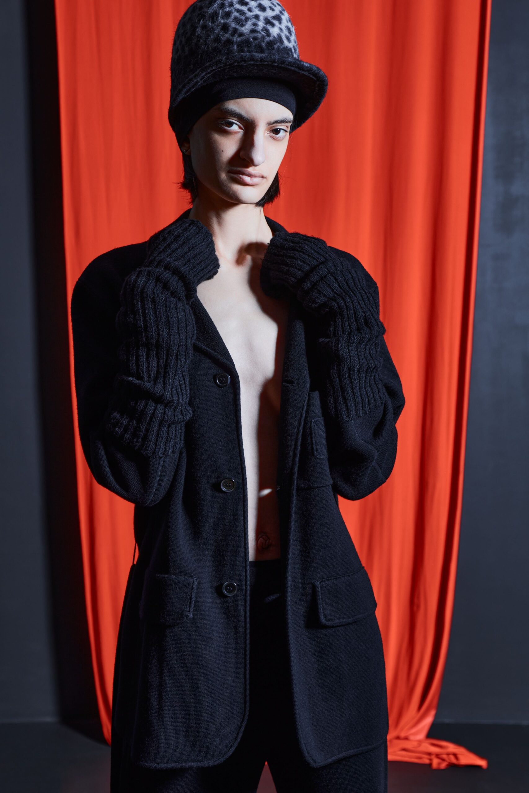 black fitted blazer with gloves and hat