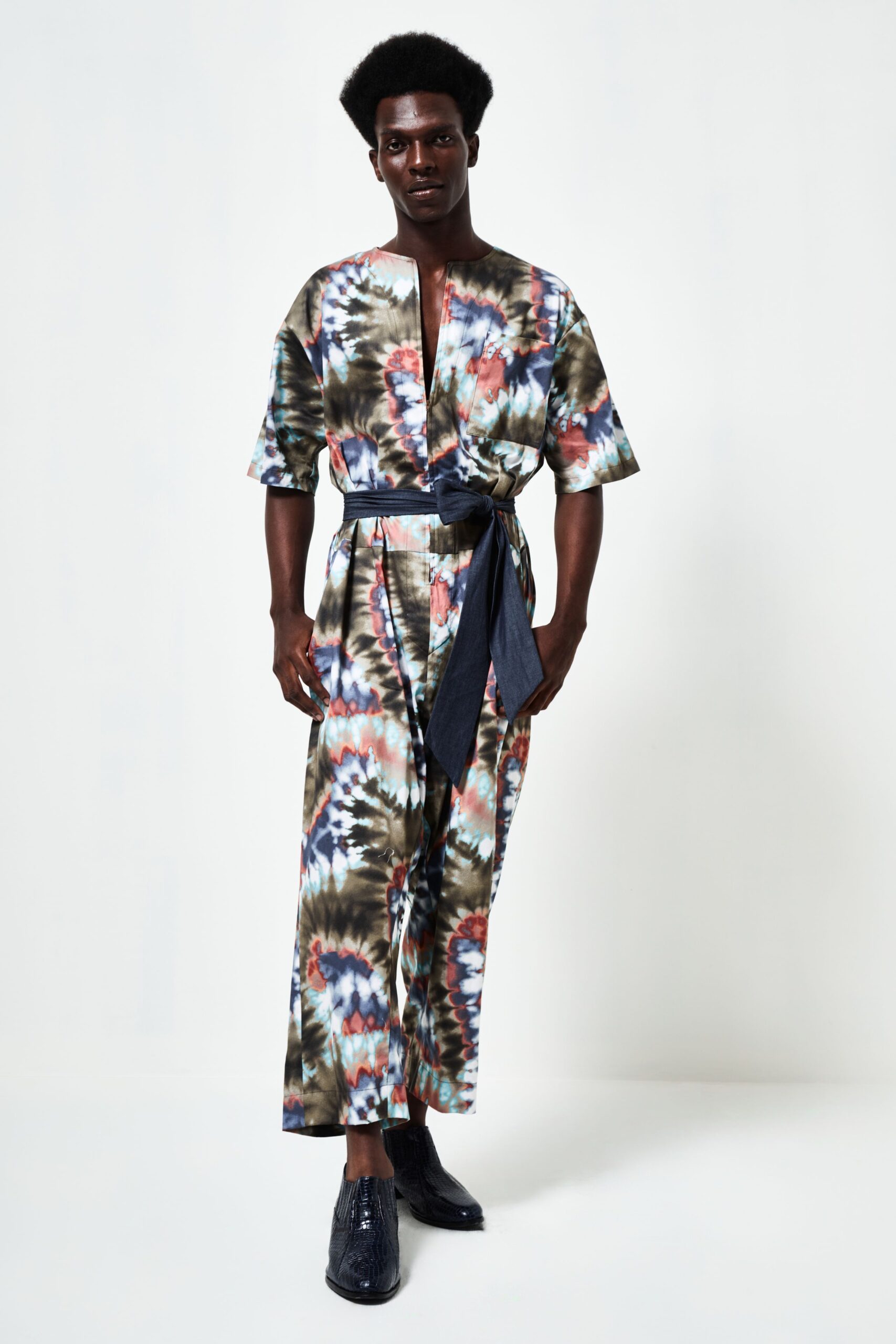 multi-colored relaxed jumpsuit with blue shoes